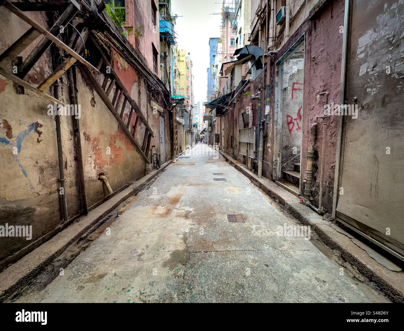 Old alleyway in the crowded district of Mong Kok in Kowloon, Hong Kong, China - Smartphone Captured Stock Image