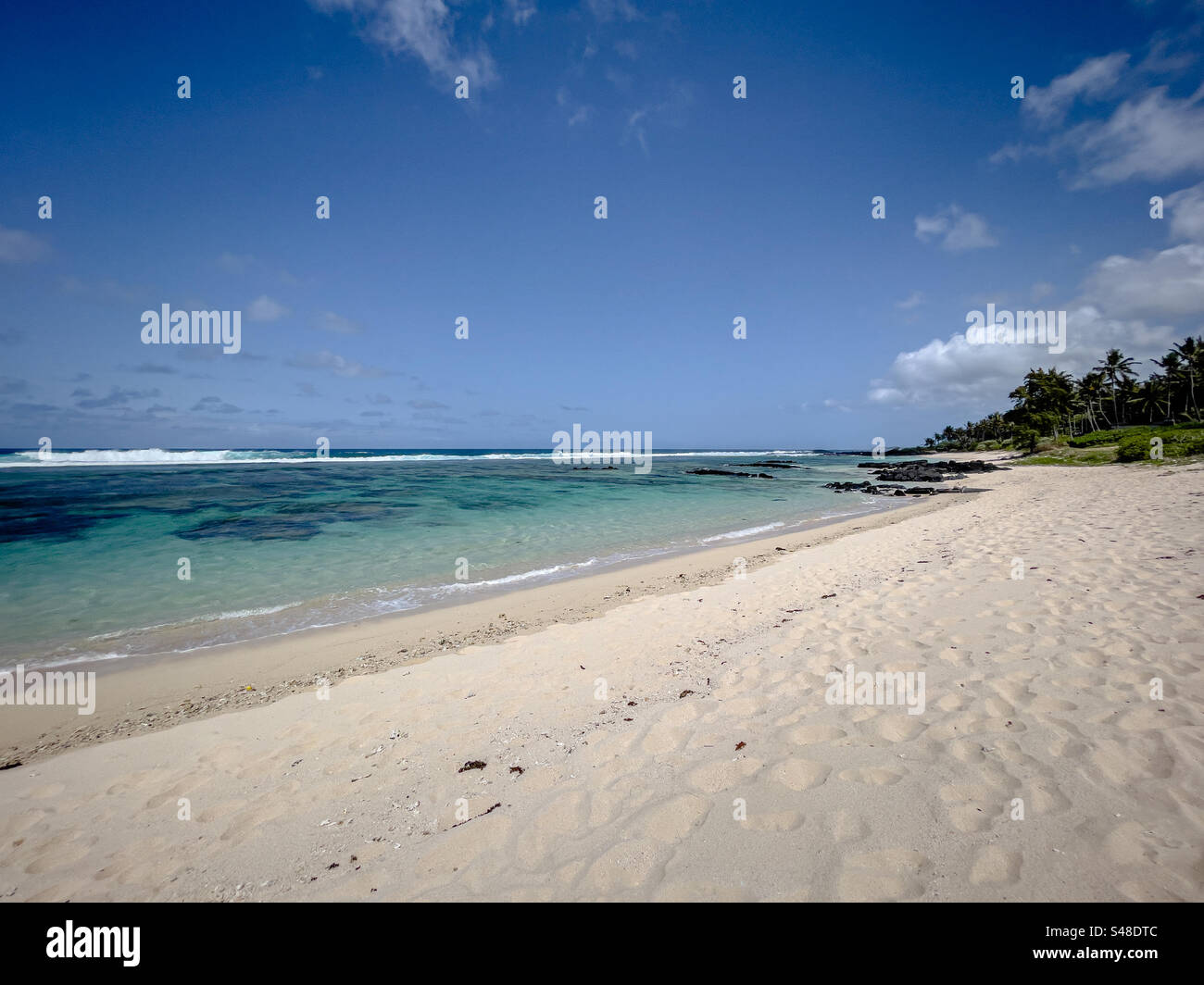Turquoise ocean water at Riambel beach, Mauritius, East Africa - Smartphone Captured Stock Image