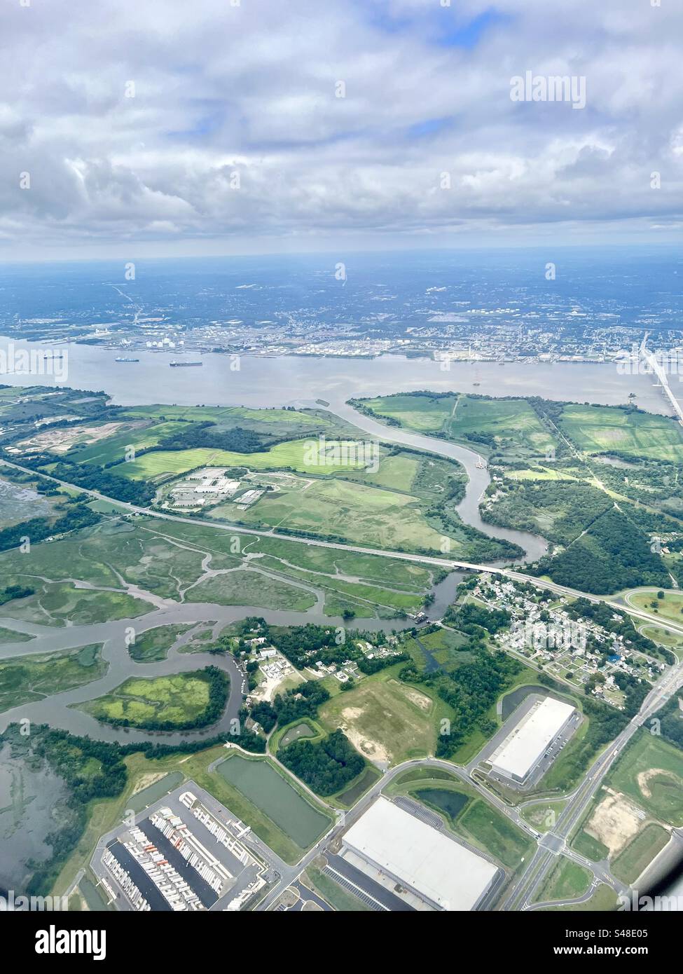 Aerial view from over Swedesboro, New Jersey looking across the Delaware River into Pennsylvania, on approach to Philadelphia International Airport - Smartphone Captured Stock Image