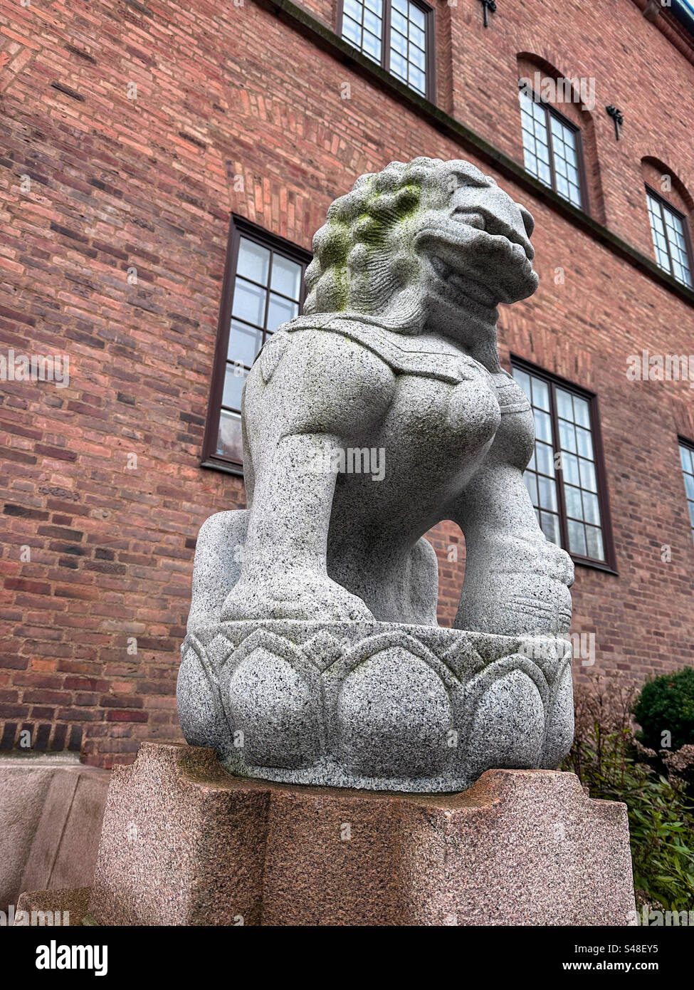 A Chinese lion outside the Museum of  Design and craft (Röhsska Museum) in Gothenburg , Sweden. - Smartphone Captured Stock Image