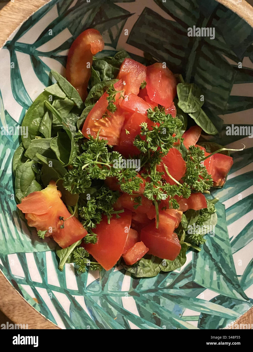 Tomato salad in decorative bowl Stock Photo