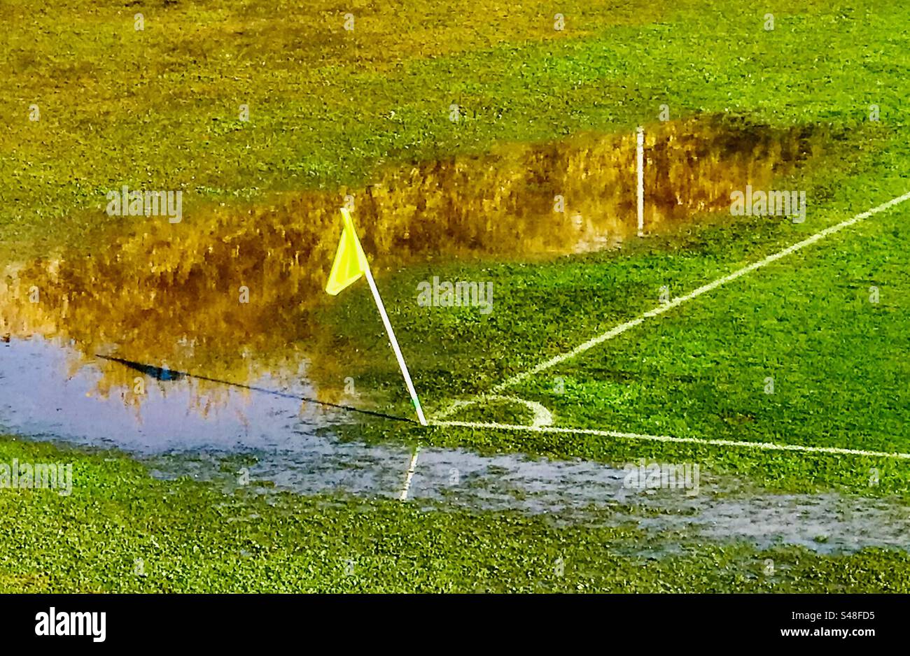 A water covered pitch of local football league match in Croatia between Omis and Zagora - Smartphone Captured Stock Image