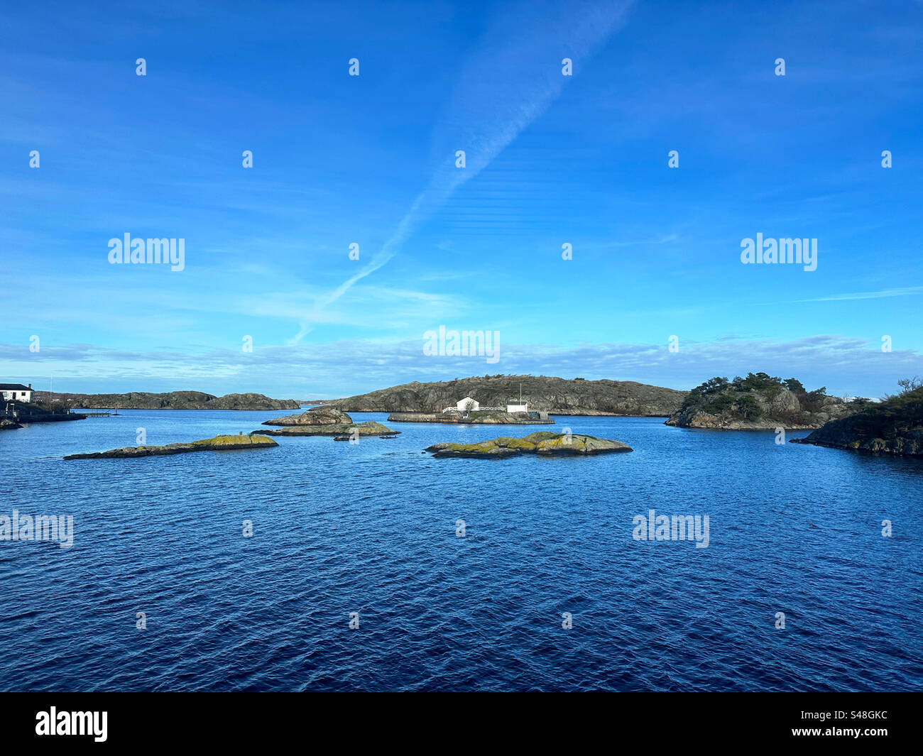 Islands in the southern archipelago beside Gothenburg, Sweden, as seen from the ferry. - Smartphone Captured Stock Image
