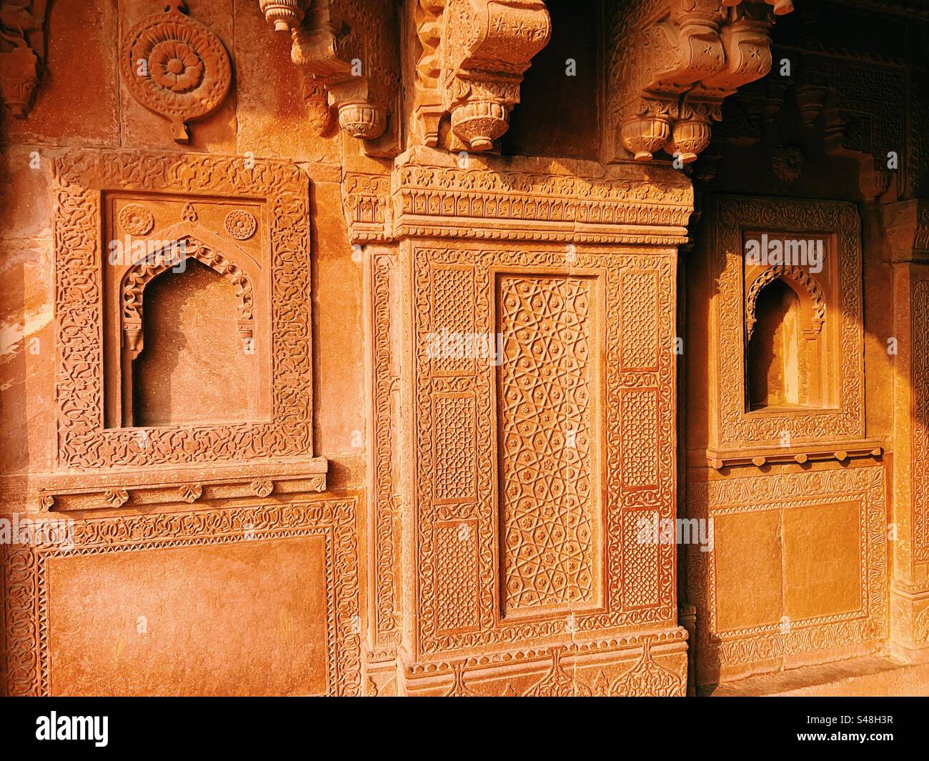 Architecture, designs of Mughal palace showing patterns and details of UNESCO World Heritage Site at Fatehpur Sikri in India - Smartphone Captured Stock Image