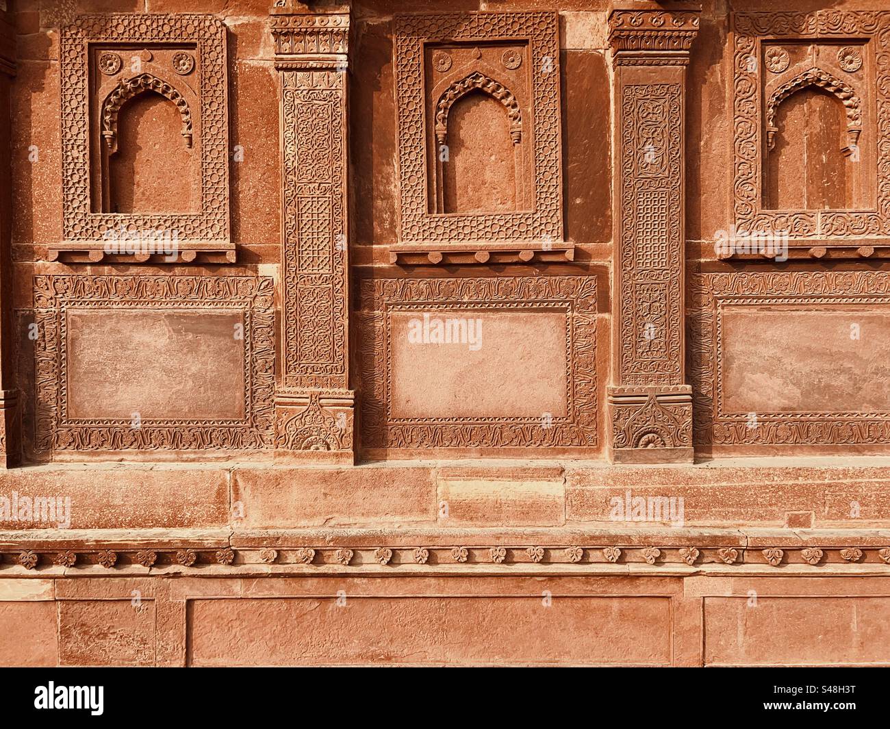 Architecture, designs of Mughal palace showing patterns and details of UNESCO World Heritage Site at Fatehpur Sikri in India - Smartphone Captured Stock Image