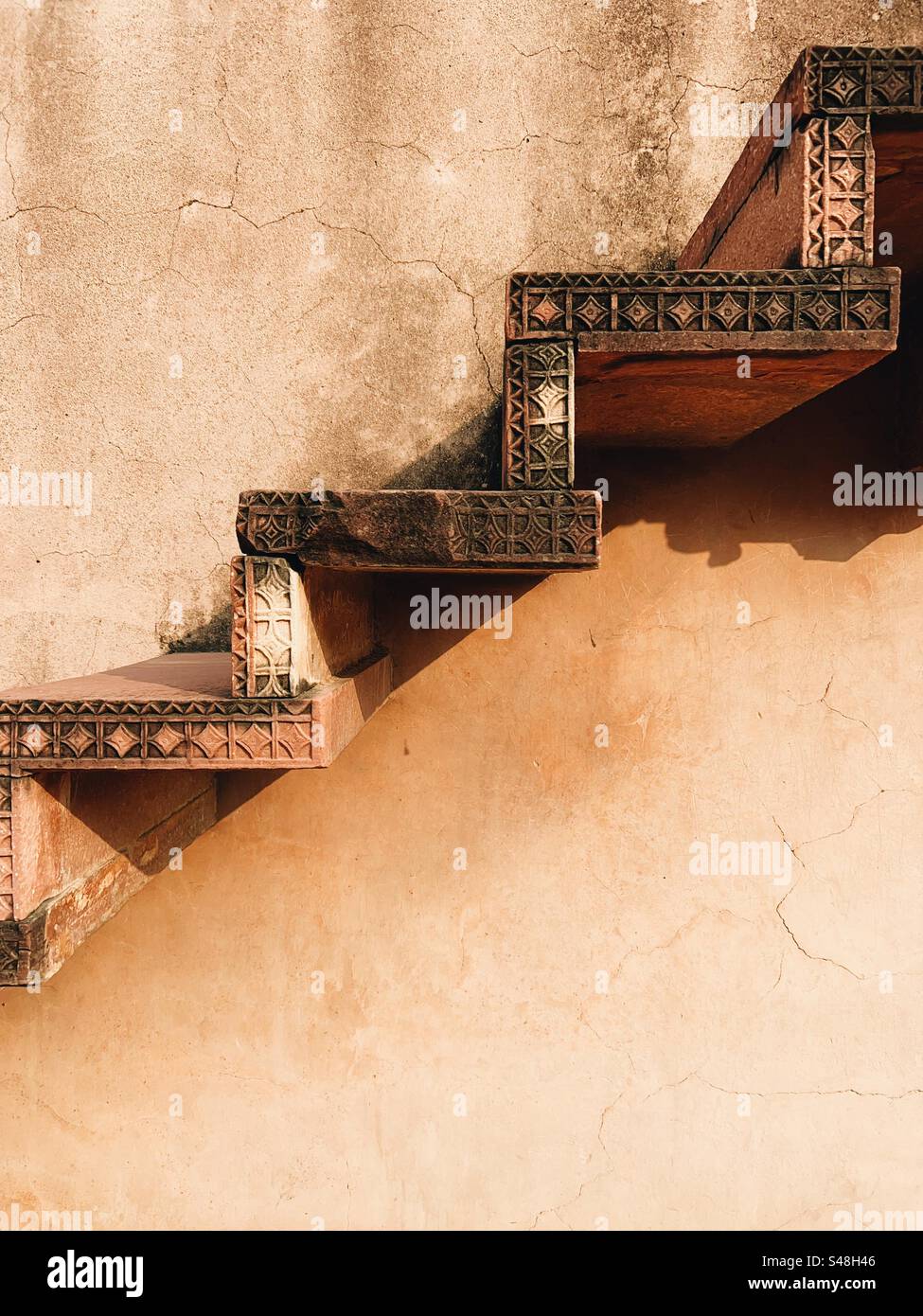 Architecture, designs of Mughal palace showing patterns and details of UNESCO World Heritage Site at Fatehpur Sikri in India - Smartphone Captured Stock Image