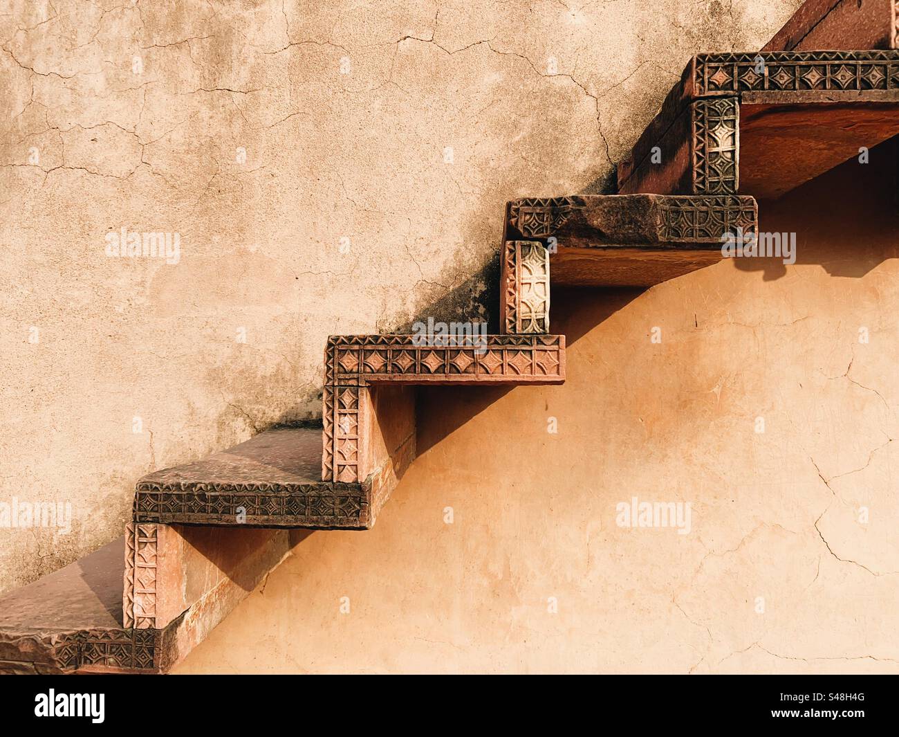 Architecture, designs of Mughal palace showing patterns and details of UNESCO World Heritage Site at Fatehpur Sikri in India - Smartphone Captured Stock Image