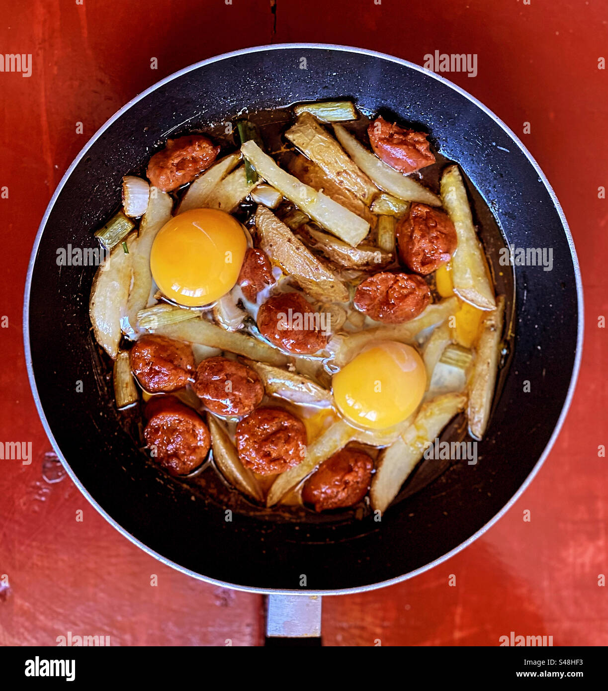 Fried potatoes with Spanish chorizo sausage and fried eggs in Queretaro