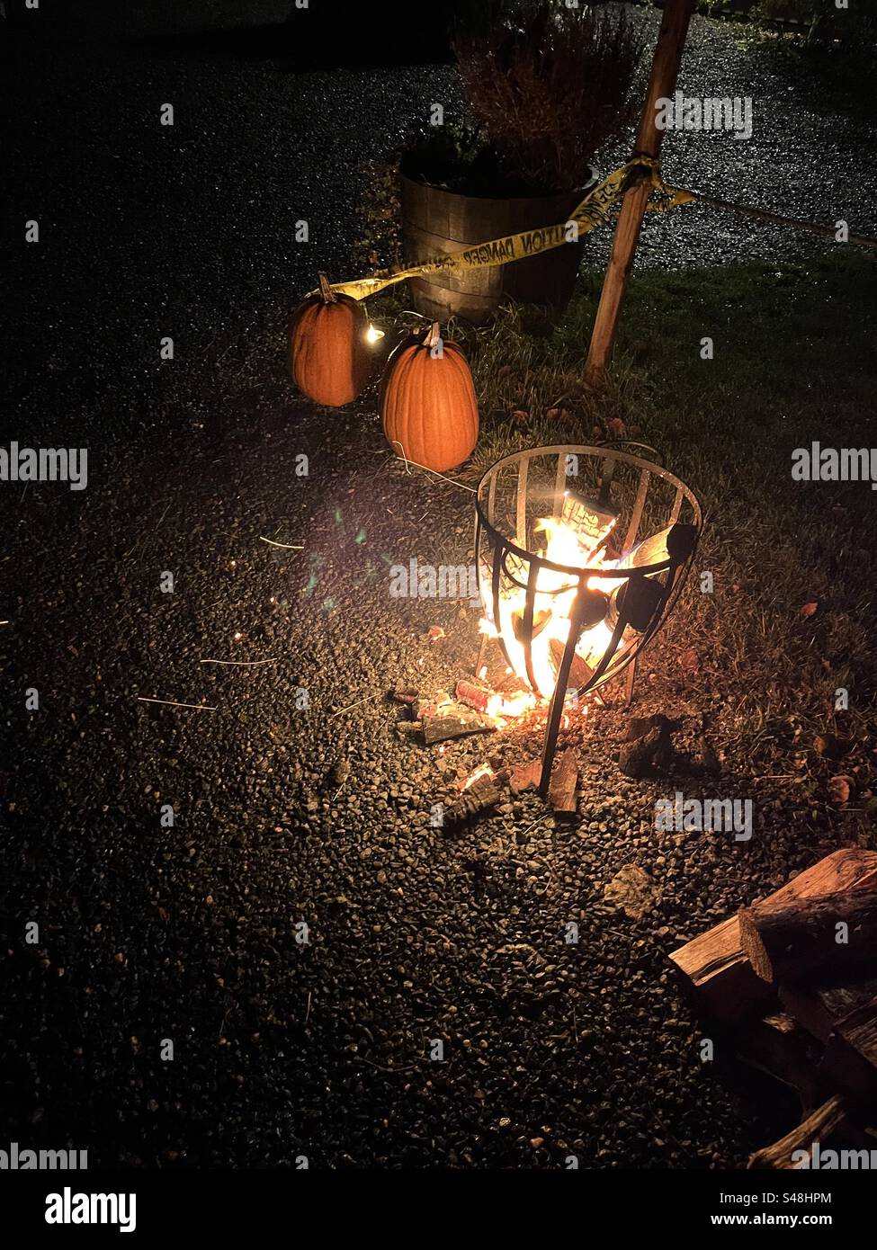 Small fire and pumpkins at Helloween celebration. Stock Photo