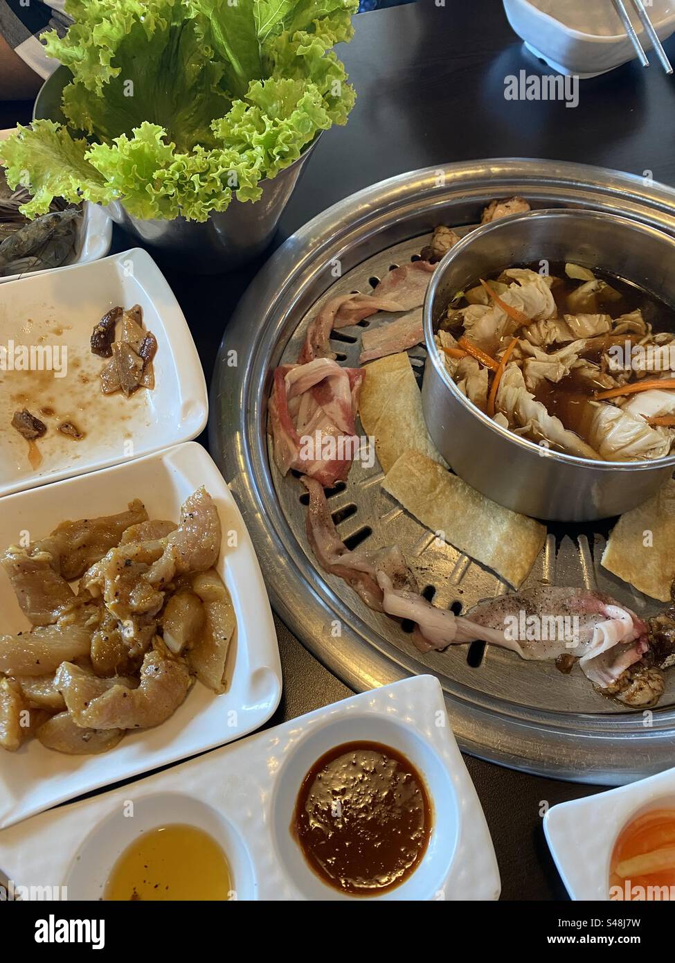 Eating in a Korean restaurant Stock Photo - Alamy