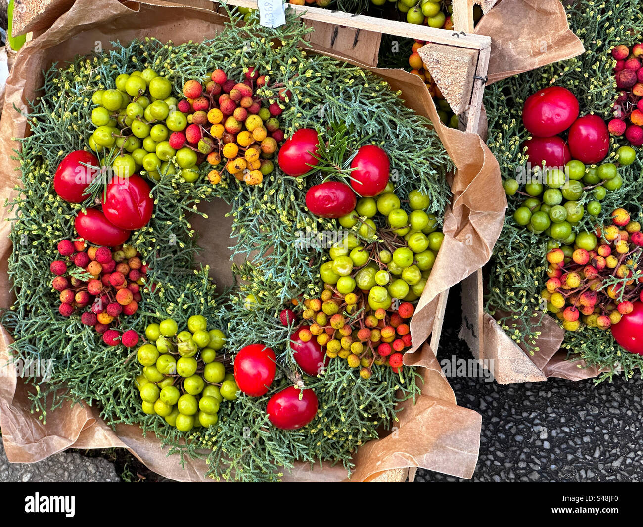 Christmas wreaths with fruits and berries in Gothenburg, Sweden. - Smartphone Captured Stock Image