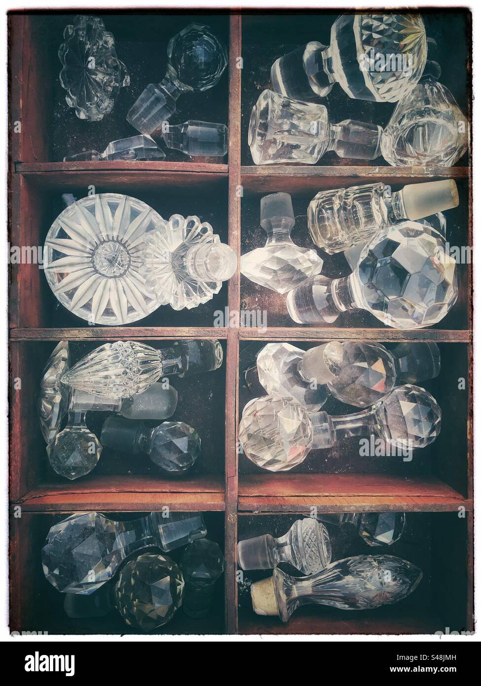 Vintage cut glass decanter tops - Smartphone Captured Stock Image