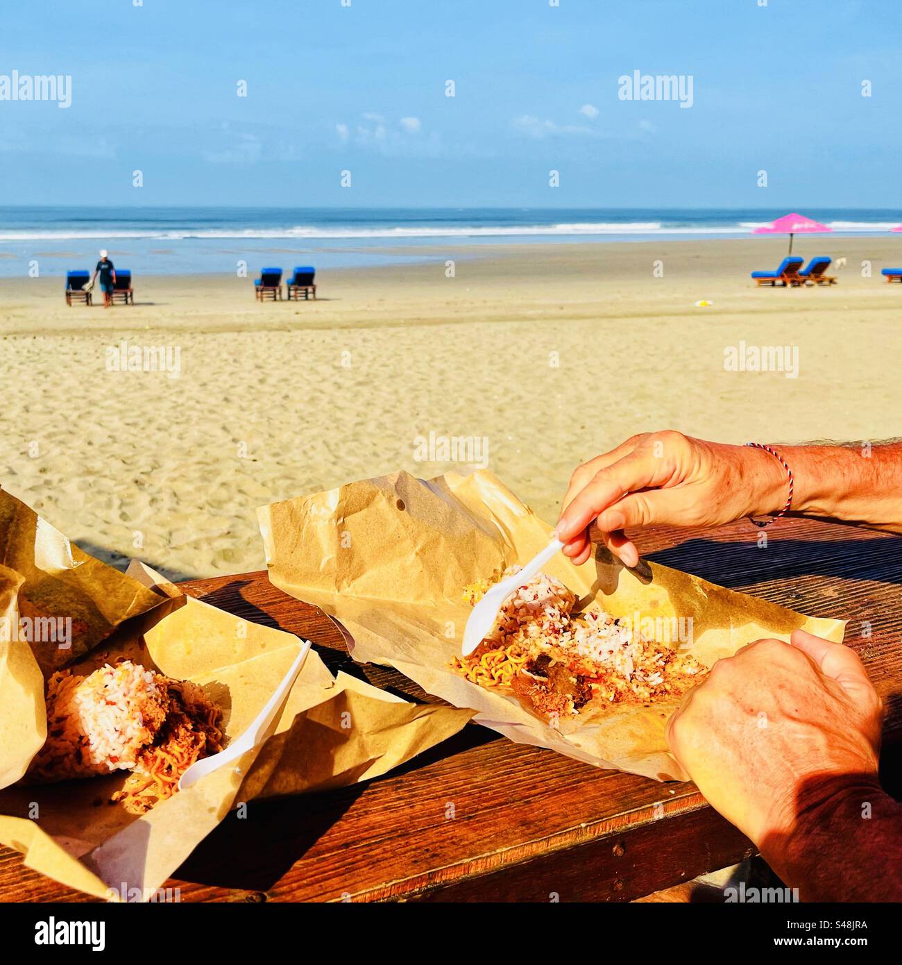 Take away rice breakfast parcel on a beach in Bali Indonesia Stock Photo