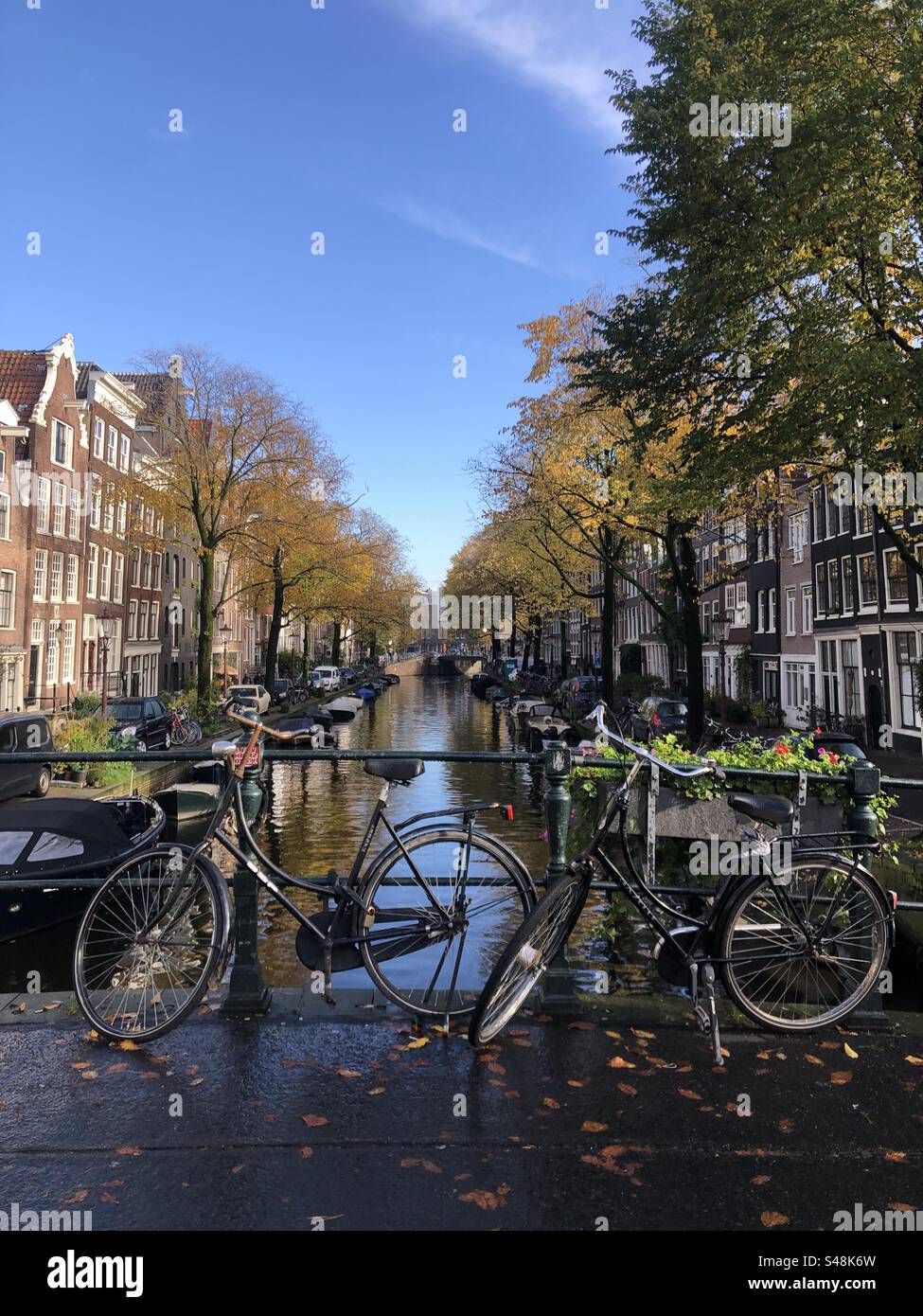 Amsterdam canal with bikes Stock Photo Alamy