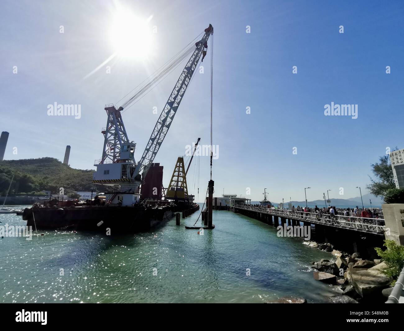 November 2023, Lamma Island, Hong Kong. Work in progress on the new ferry pier in Yung Shue Wan. - Smartphone Captured Stock Image