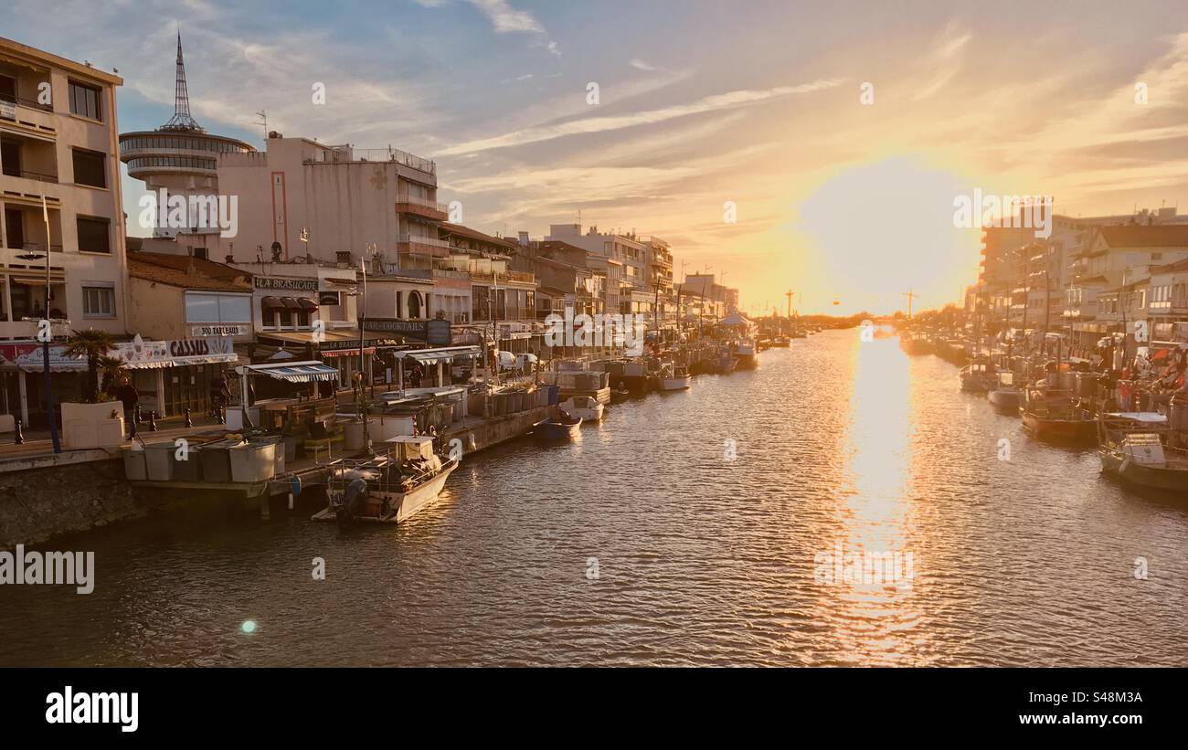 Landscape shot of the canal at sunset in Palavas-les-Flots, Occitanie, France - Smartphone Captured Stock Image