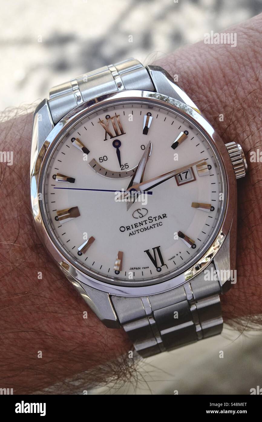 Close-up macro shot of a stainless steel OrientStar Automatic Watch - Smartphone Captured Stock Image