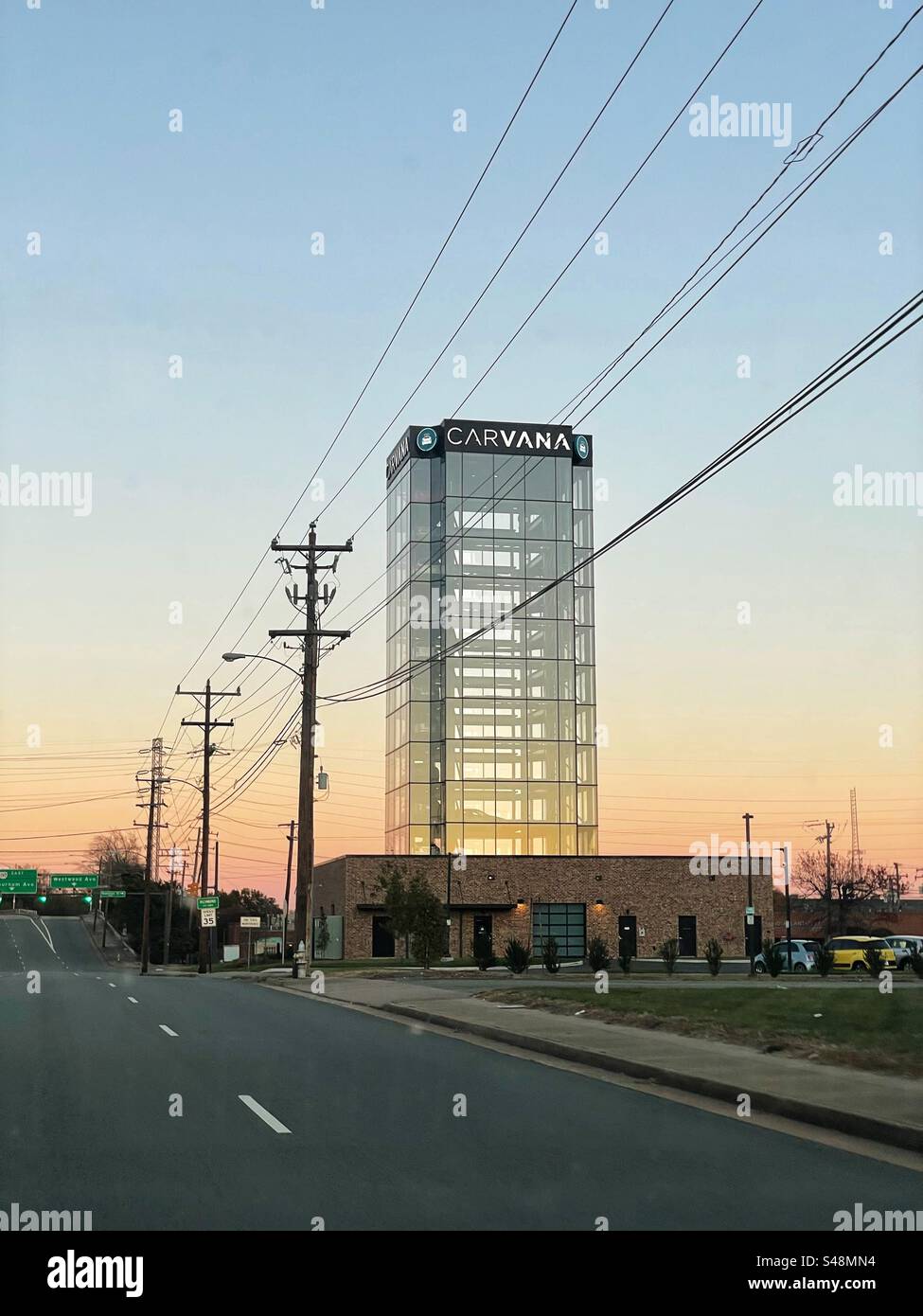 An empty Carvana vending machine tower in Richmond, VA at sunset Stock