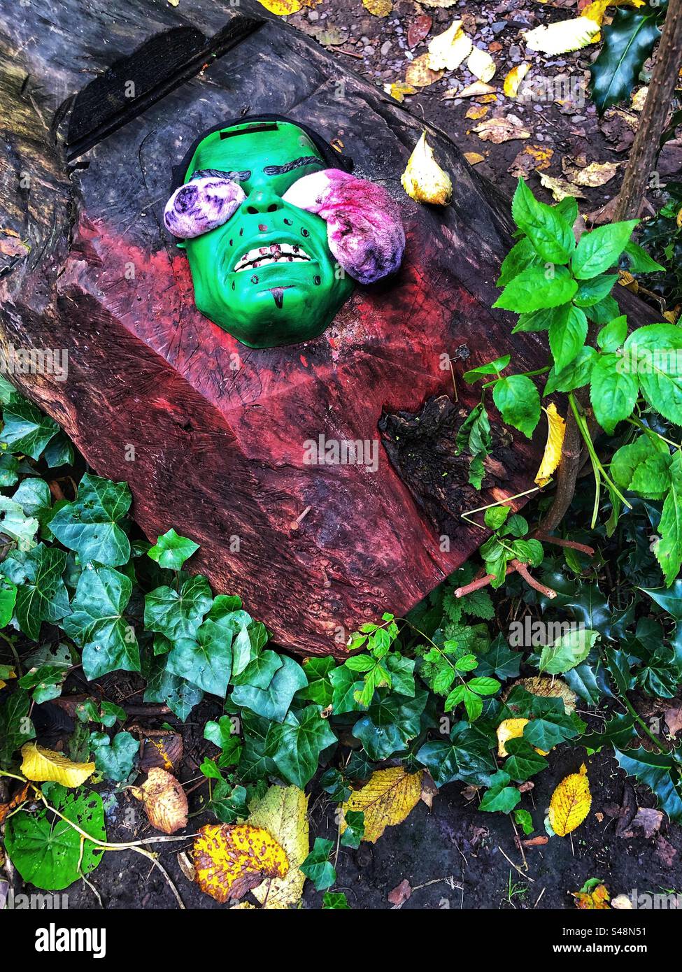 Halloween mask in the garden Stock Photo