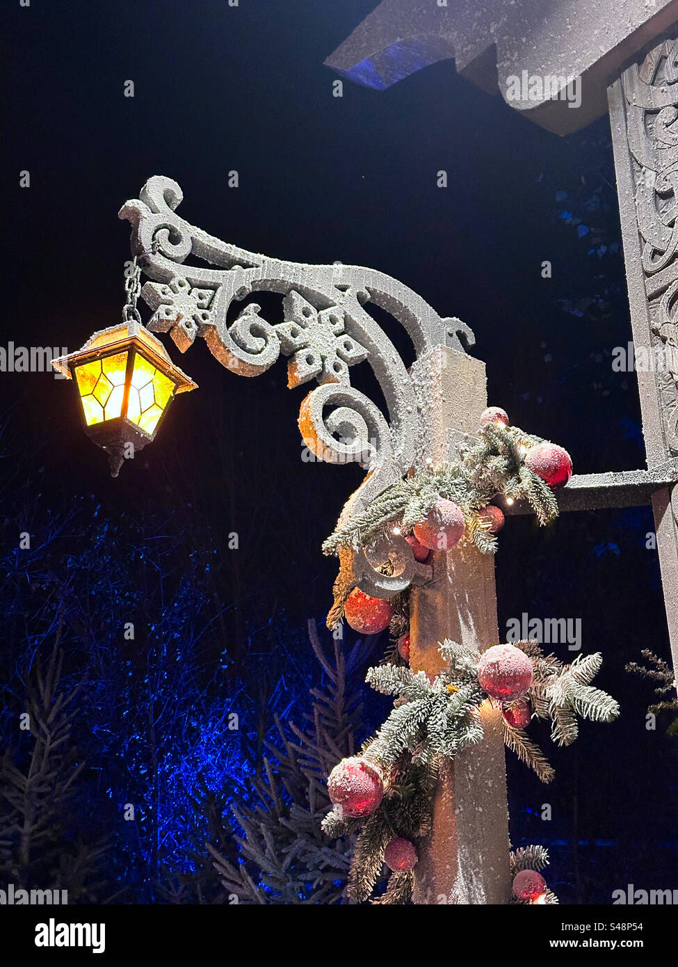 A hanging lantern set in a winter Christmas  scene at Liseberg theme park at Gothenburg, Sweden. - Smartphone Captured Stock Image