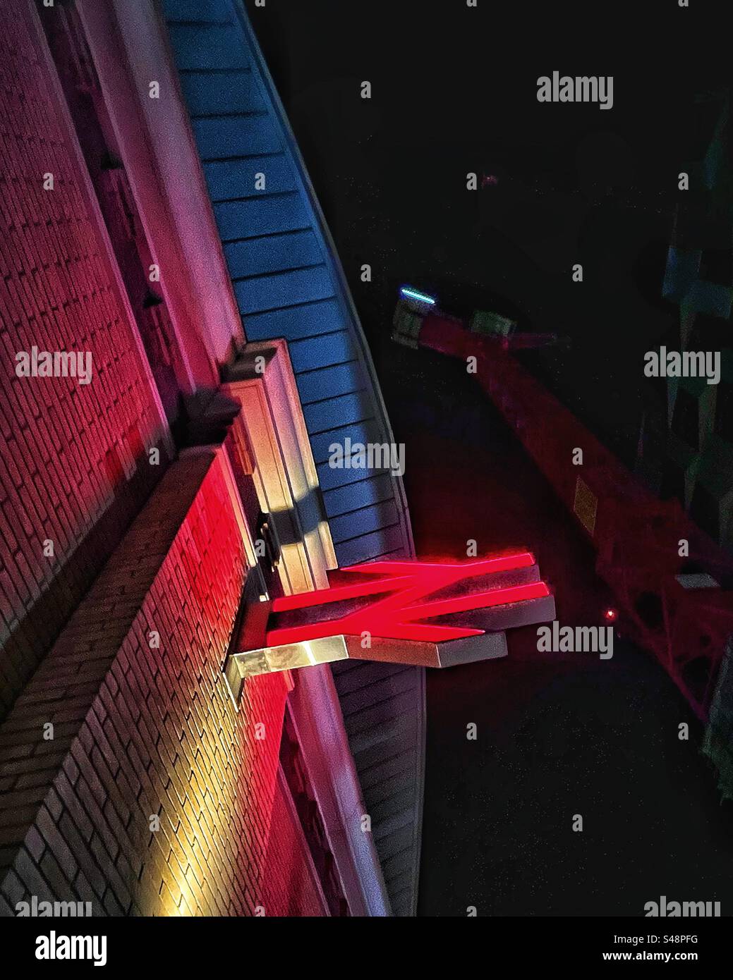 Close up National Railway sign at London Bridge Station at night formerly British Rail logo - Smartphone Captured Stock Image