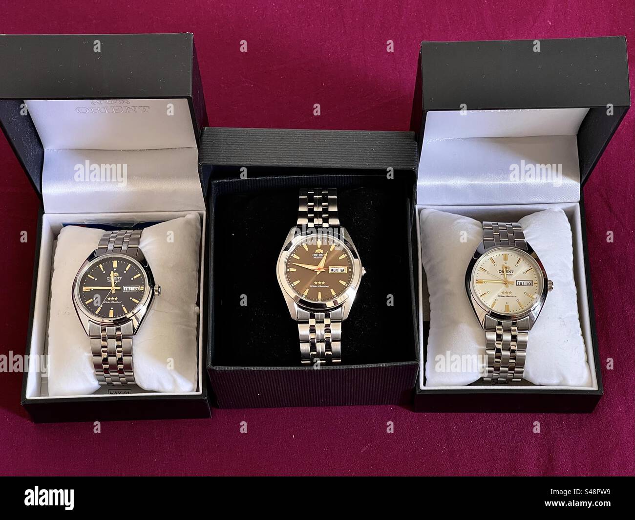 A set of three Orient Tristar watches in their jewel boxes - Smartphone Captured Stock Image