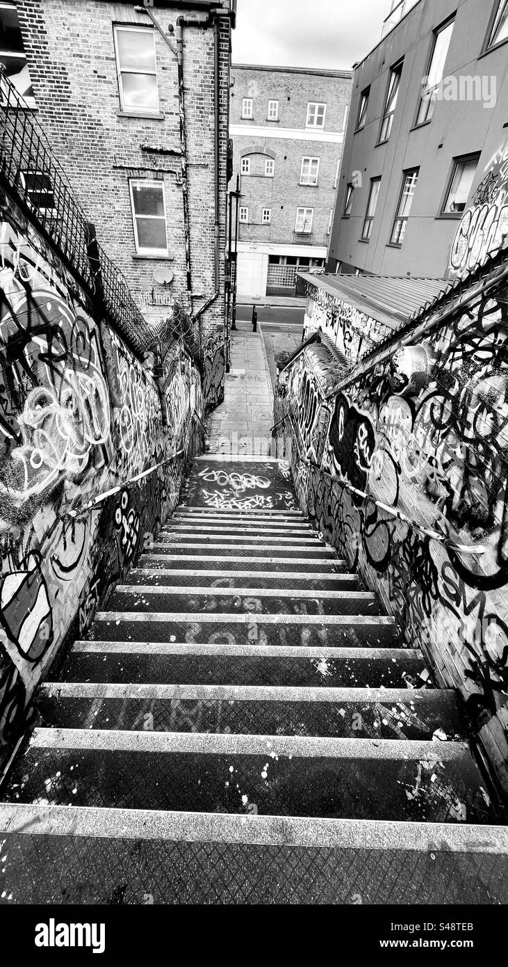 Stairwell in Brick Lane, East London presenting a gritty urban environment. Stock Photo