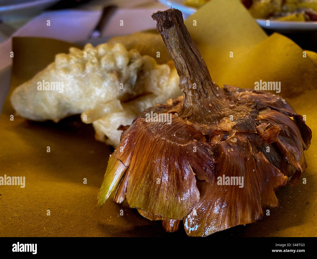 Plate of fried artichoke, a specialty appetizer in Rome - Smartphone Captured Stock Image