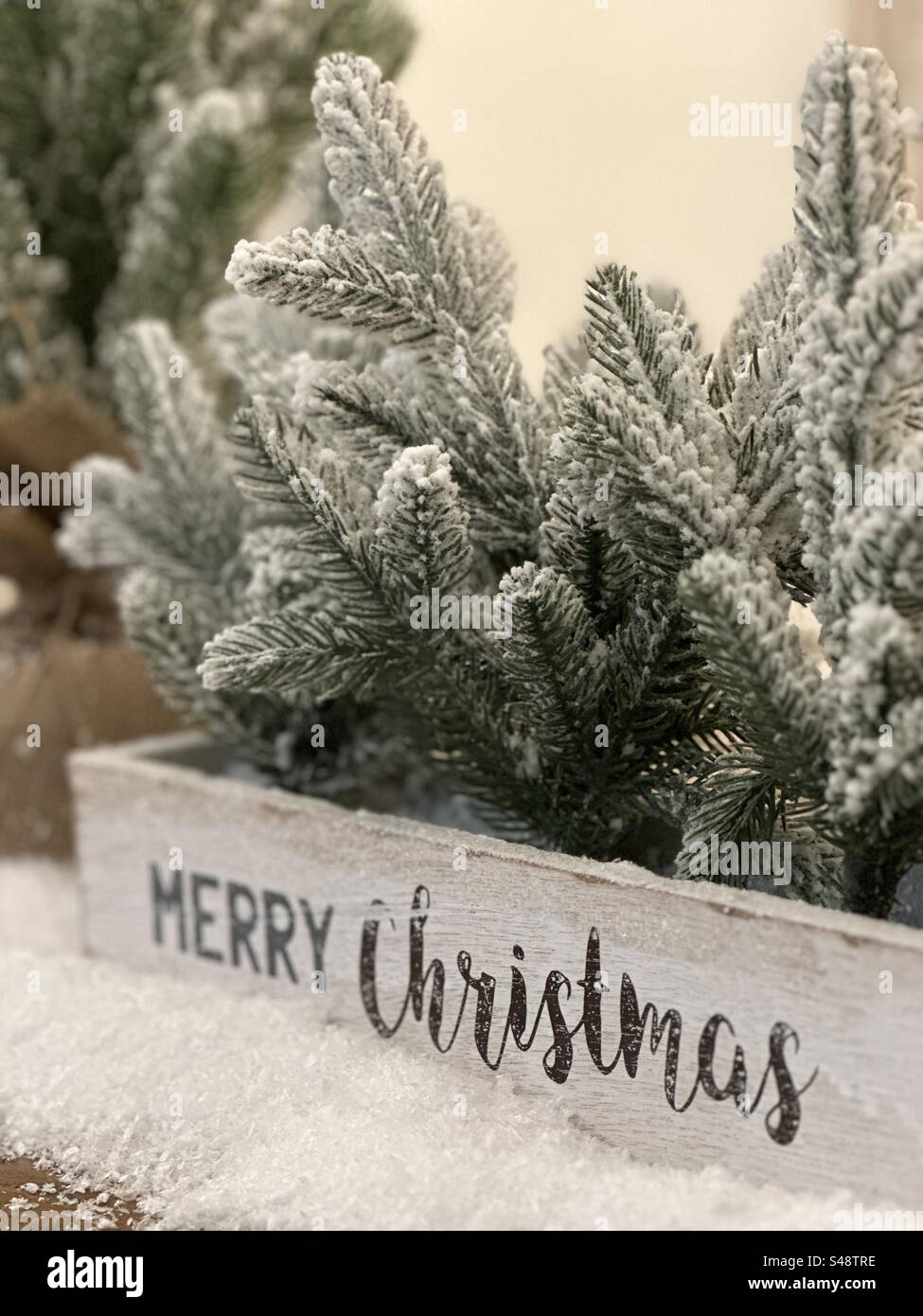 Christmas decorations on a table with message box and pine tree needles - Smartphone Captured Stock Image