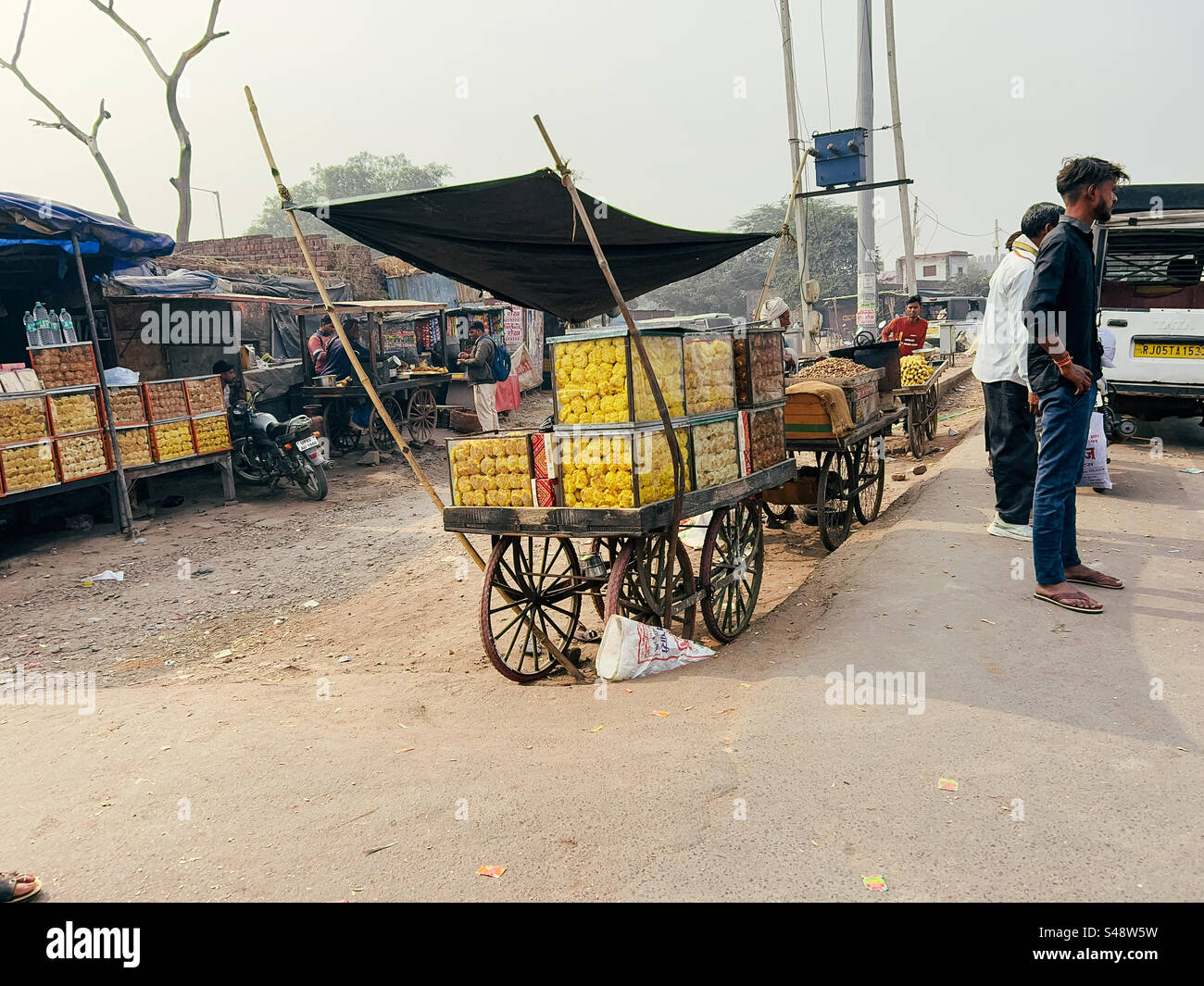 Carts selling Indian snacks by a highway in India - Smartphone Captured Stock Image