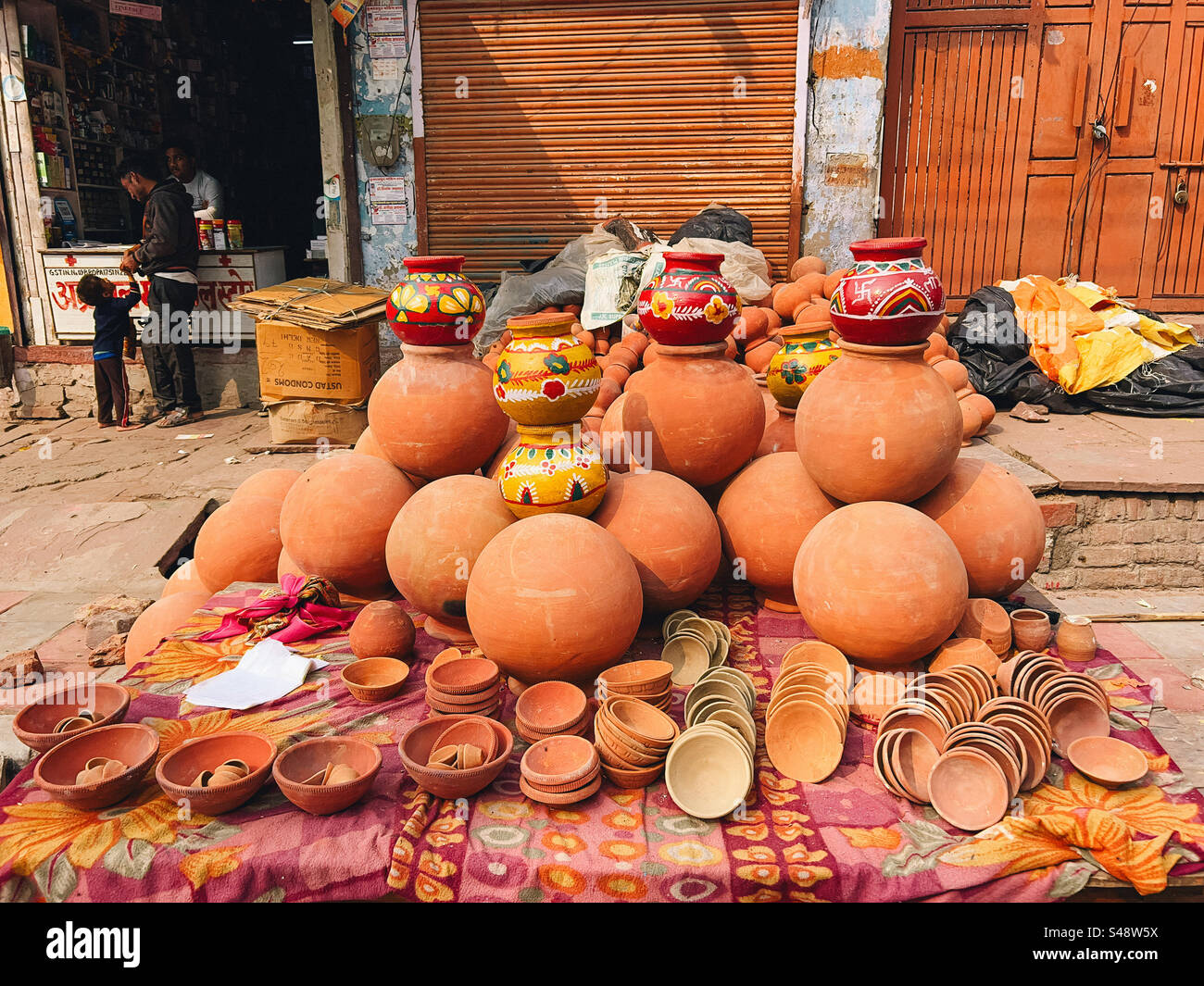 Earthen pots for sale on the street at a market in India - Smartphone Captured Stock Image
