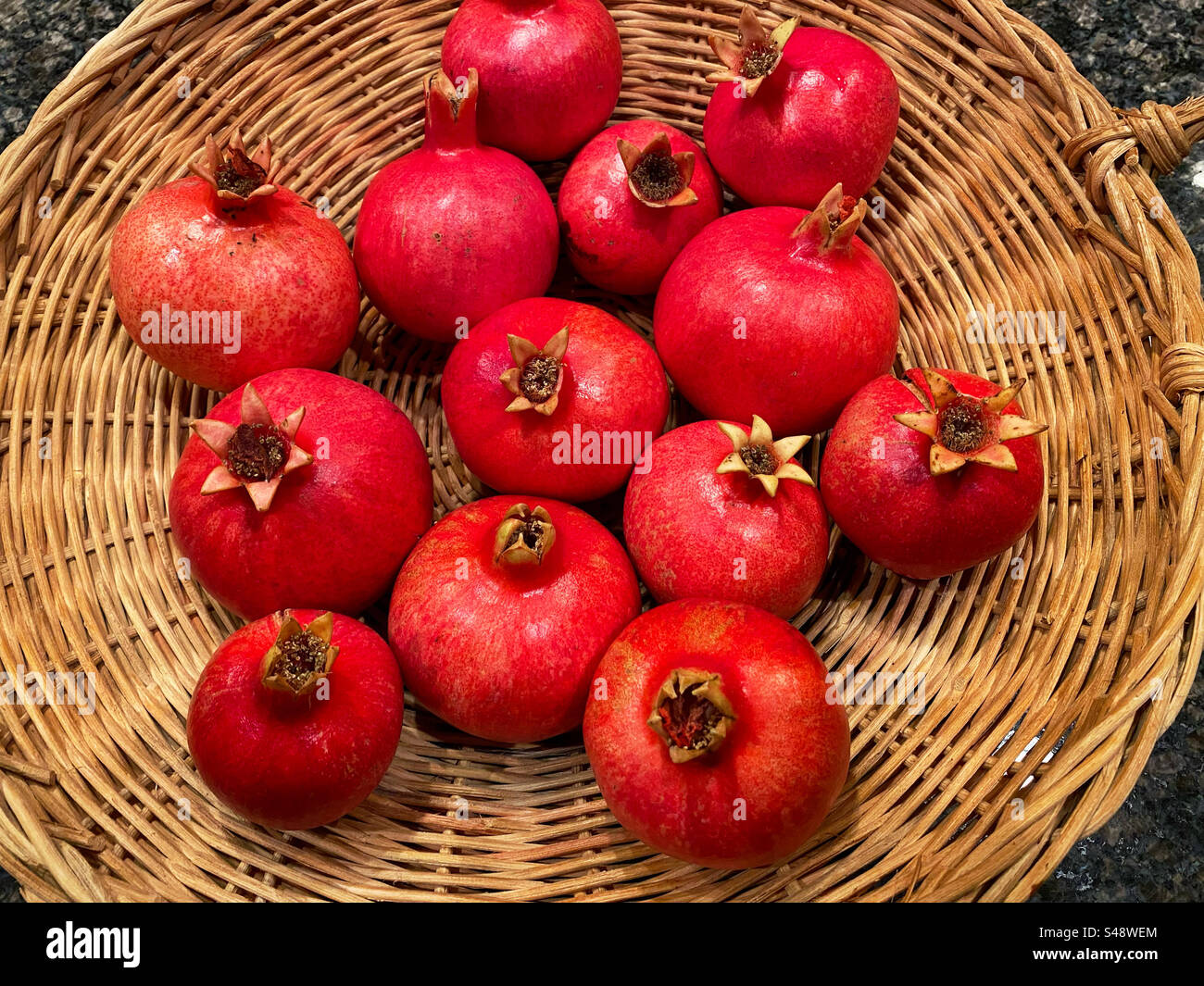 Pomegranates in a wicker basket - Smartphone Captured Stock Image