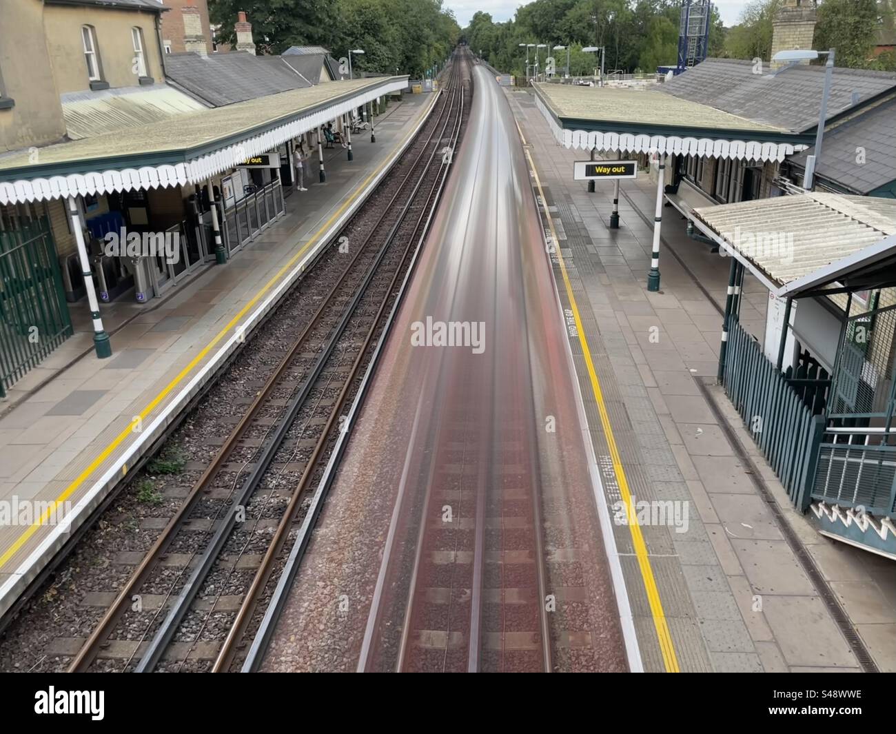 Long exposure of a tube train arriving at North Finchley tube station - Smartphone Captured Stock Image