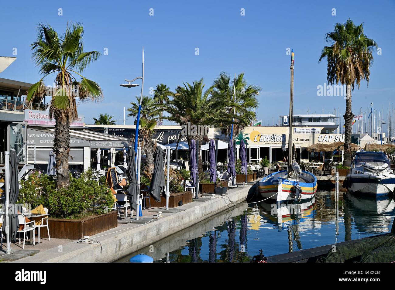Shot of the marina port and its restaurants in PalavaslesFlots