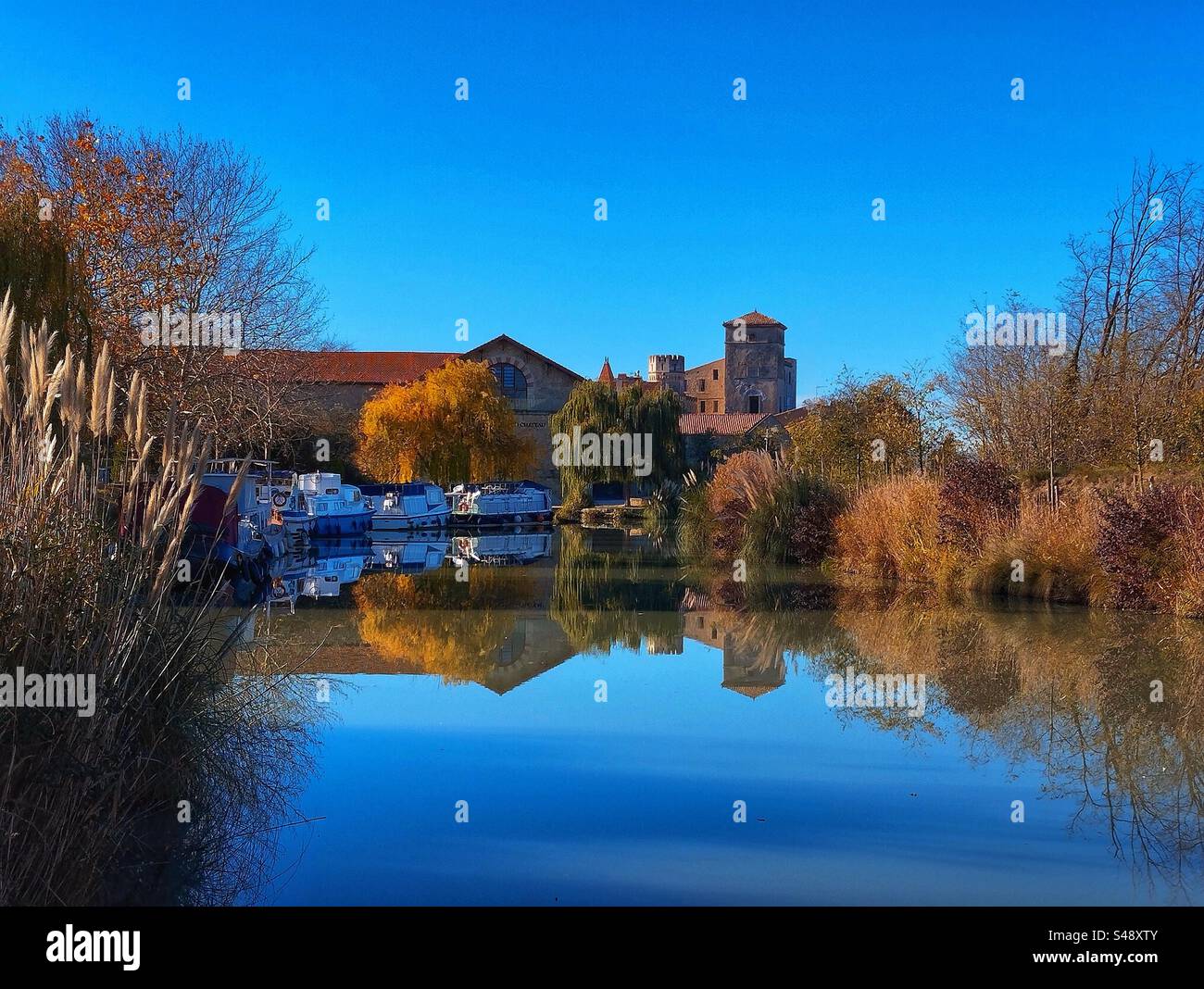 Port of Colombiers in Autumn. Canal du Midi. Occitanie, France - Smartphone Captured Stock Image