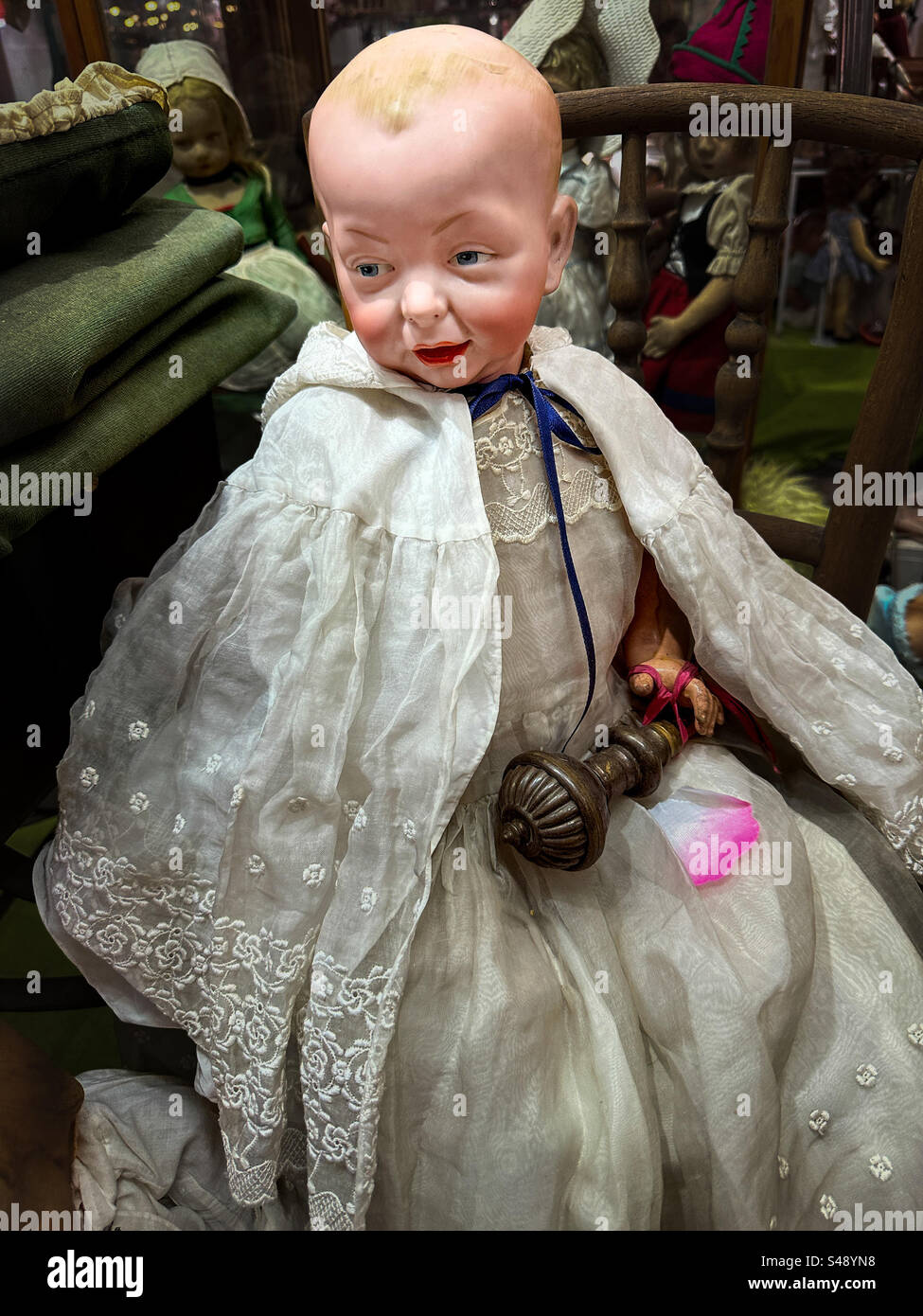 Vintage porcelain doll in an antique shop Stock Photo