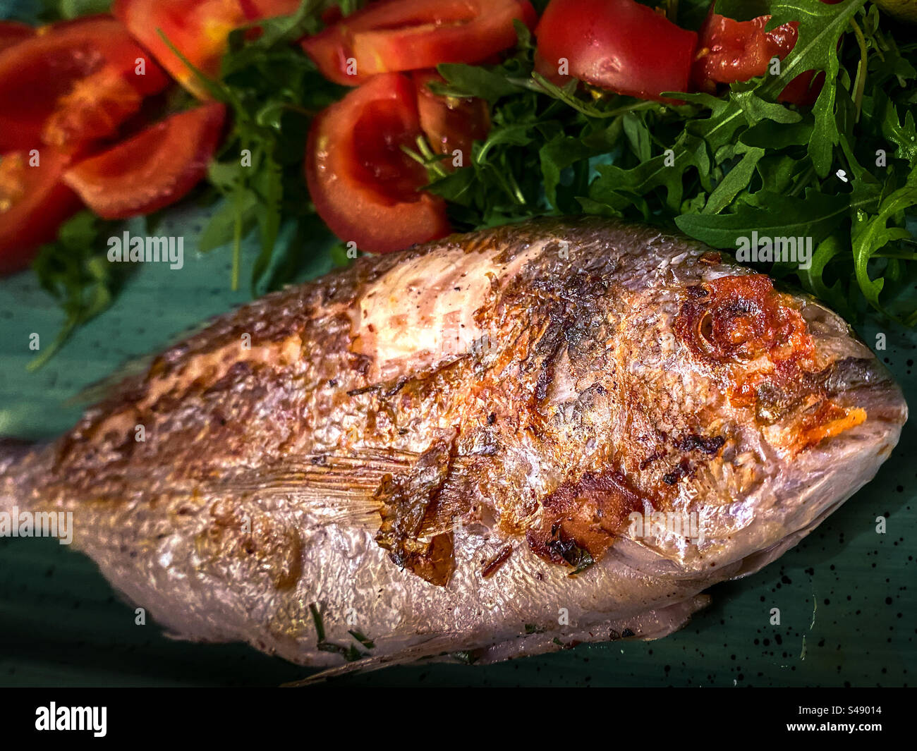Plate of fried whole fish at Chinese restaurant - Smartphone Captured Stock Image