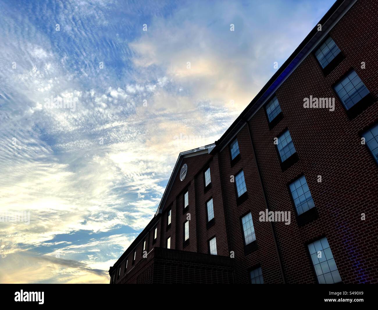 Harrisburg, Pennsylvania, USA - August 2023:  Sunset near brick building - Smartphone Captured Stock Image
