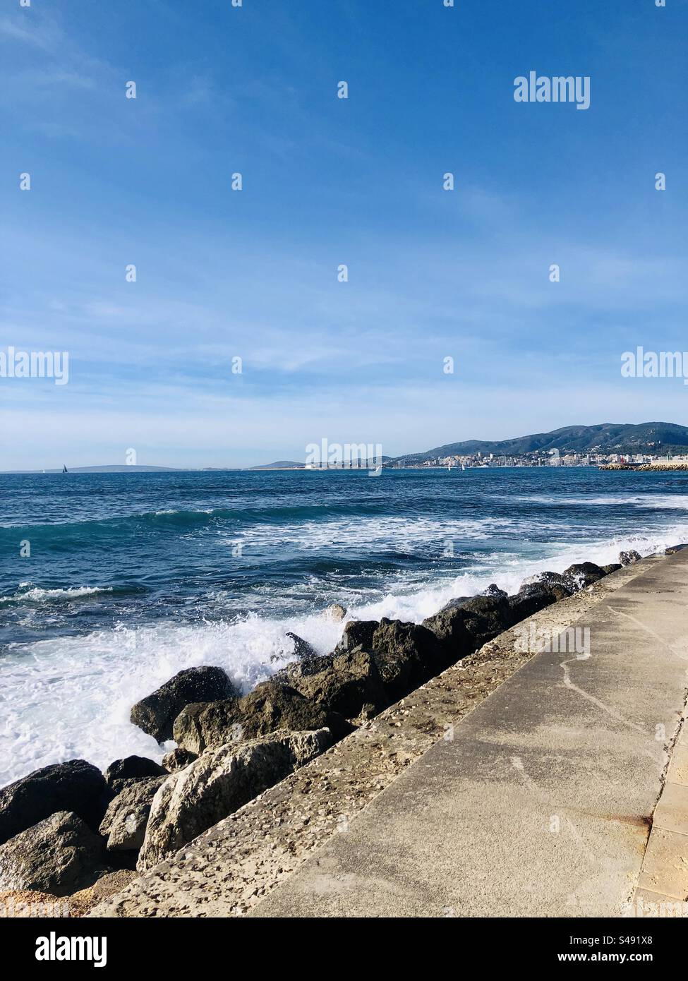Beachline coastline of portitxol mallorca on a sunny sunday - Smartphone Captured Stock Image