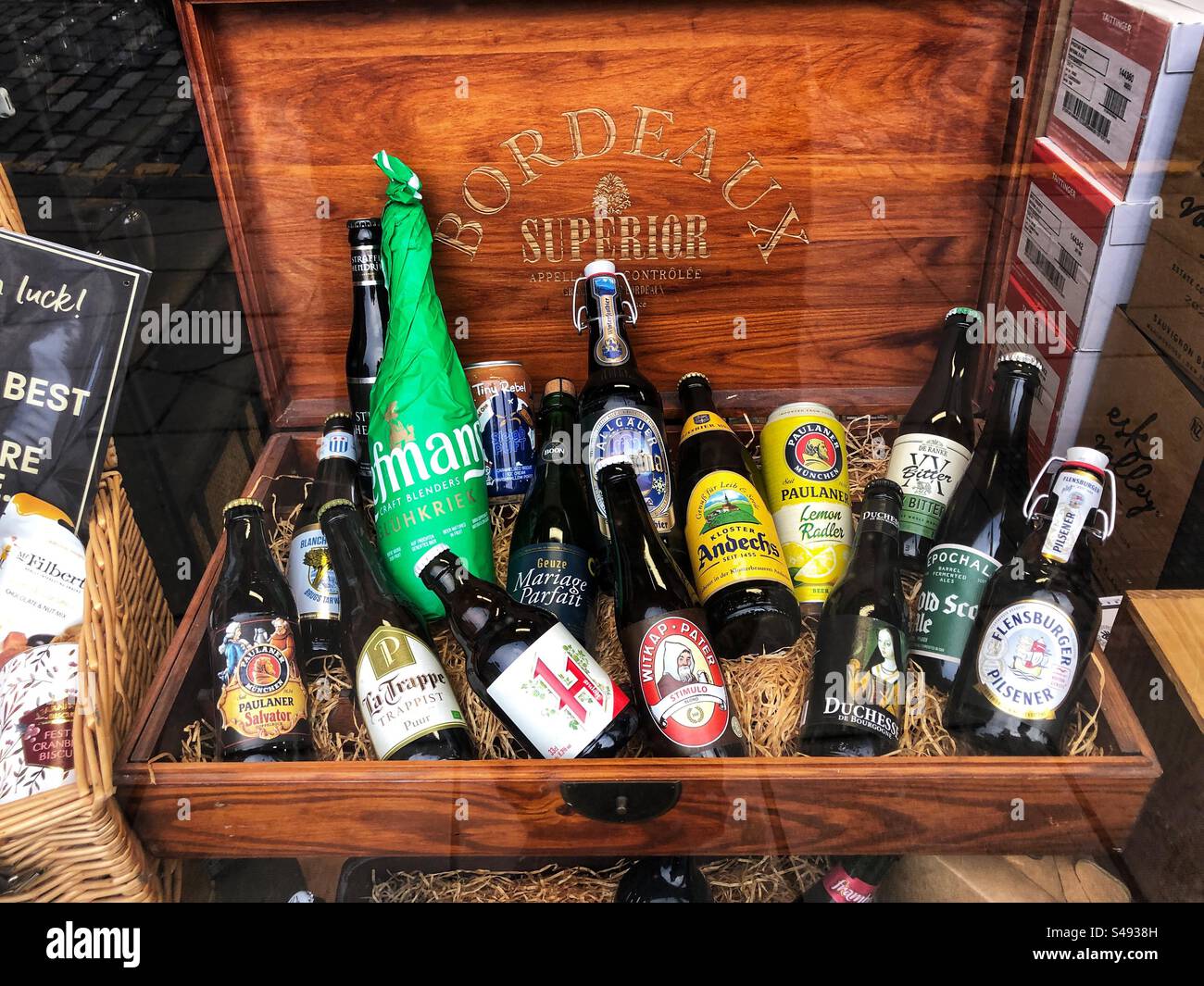 Christmas wooden Gift box full of beers in an off licence window - Smartphone Captured Stock Image Christmas wooden Gift box full of beers in an off licence window - Smartphone Captured Stock Image