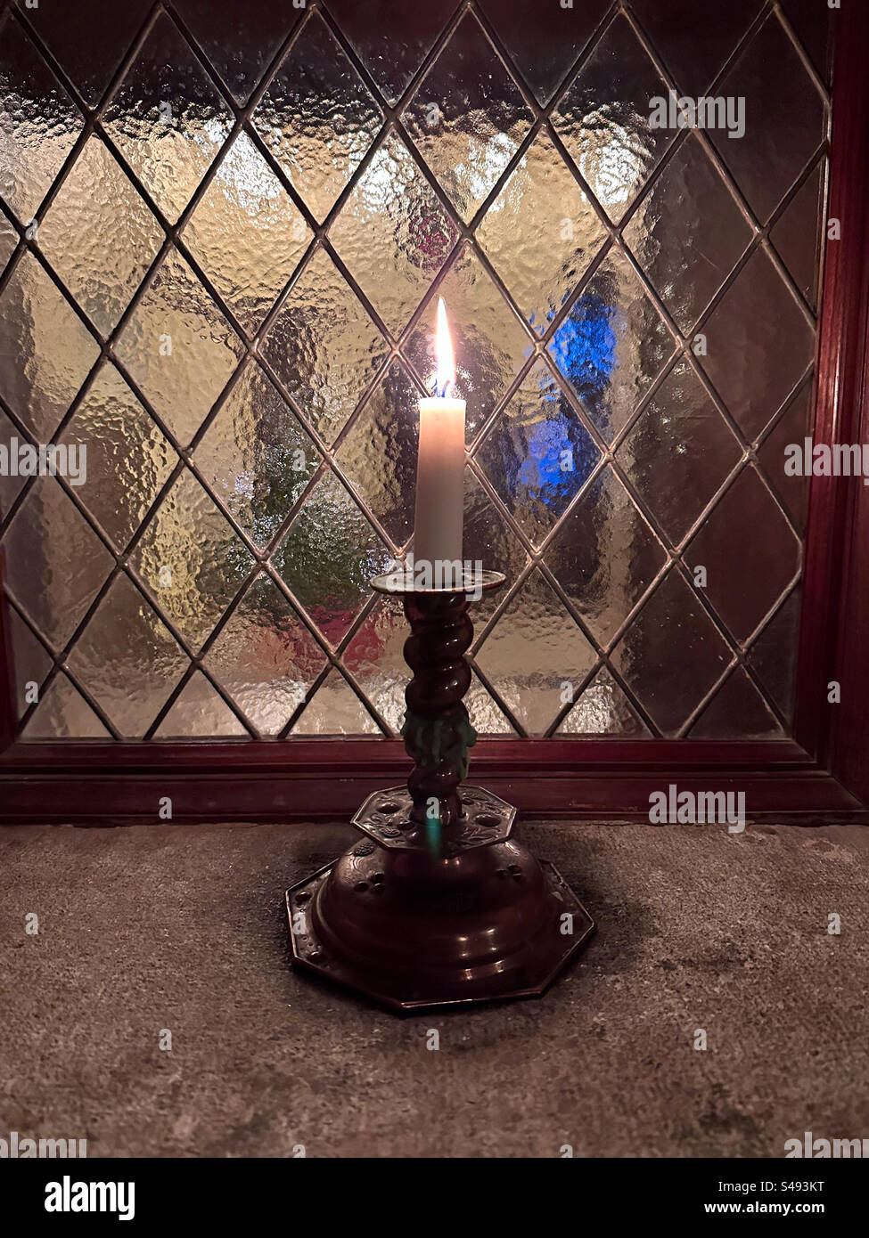 A candle in a window in tjol holms slott a castle in halland sweden