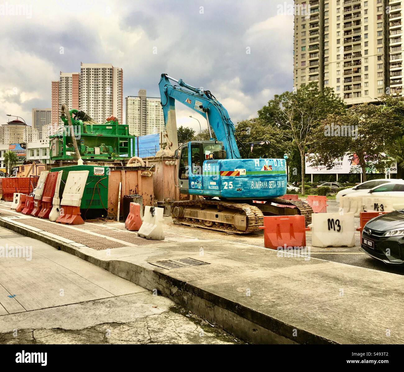 Editorial photo of kobeco machines and micro sewer repair machines on the side of the road on December 15, 2023 in the city of Kuala Lumpur, Malaysia Stock Photo