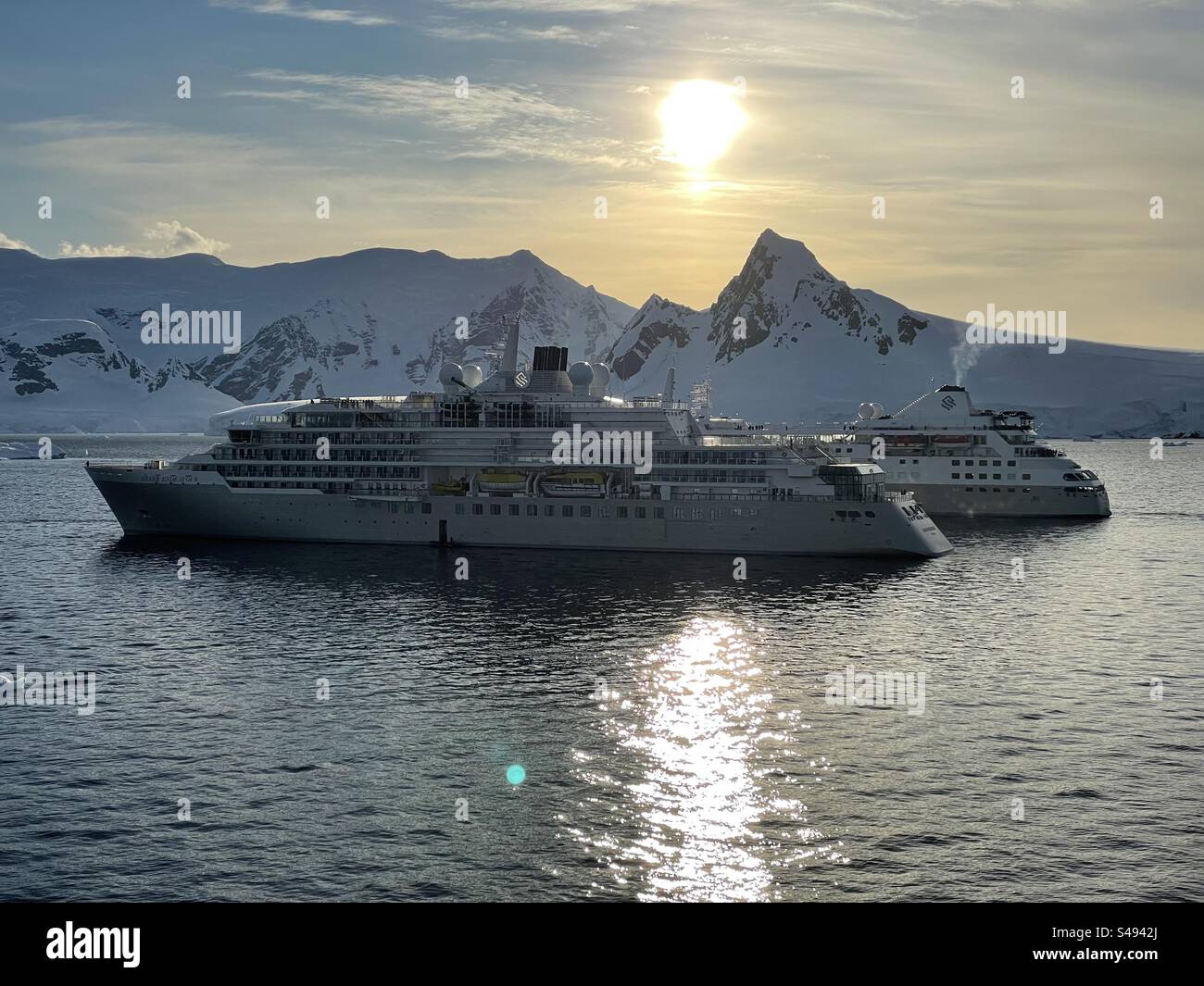 Two small luxury cruise ships in the Antarctic Peninsula - Smartphone Captured Stock Image