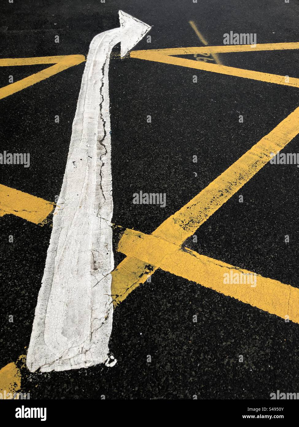 Turning right ahead Arrow Road markings on box junction - Smartphone Captured Stock Image