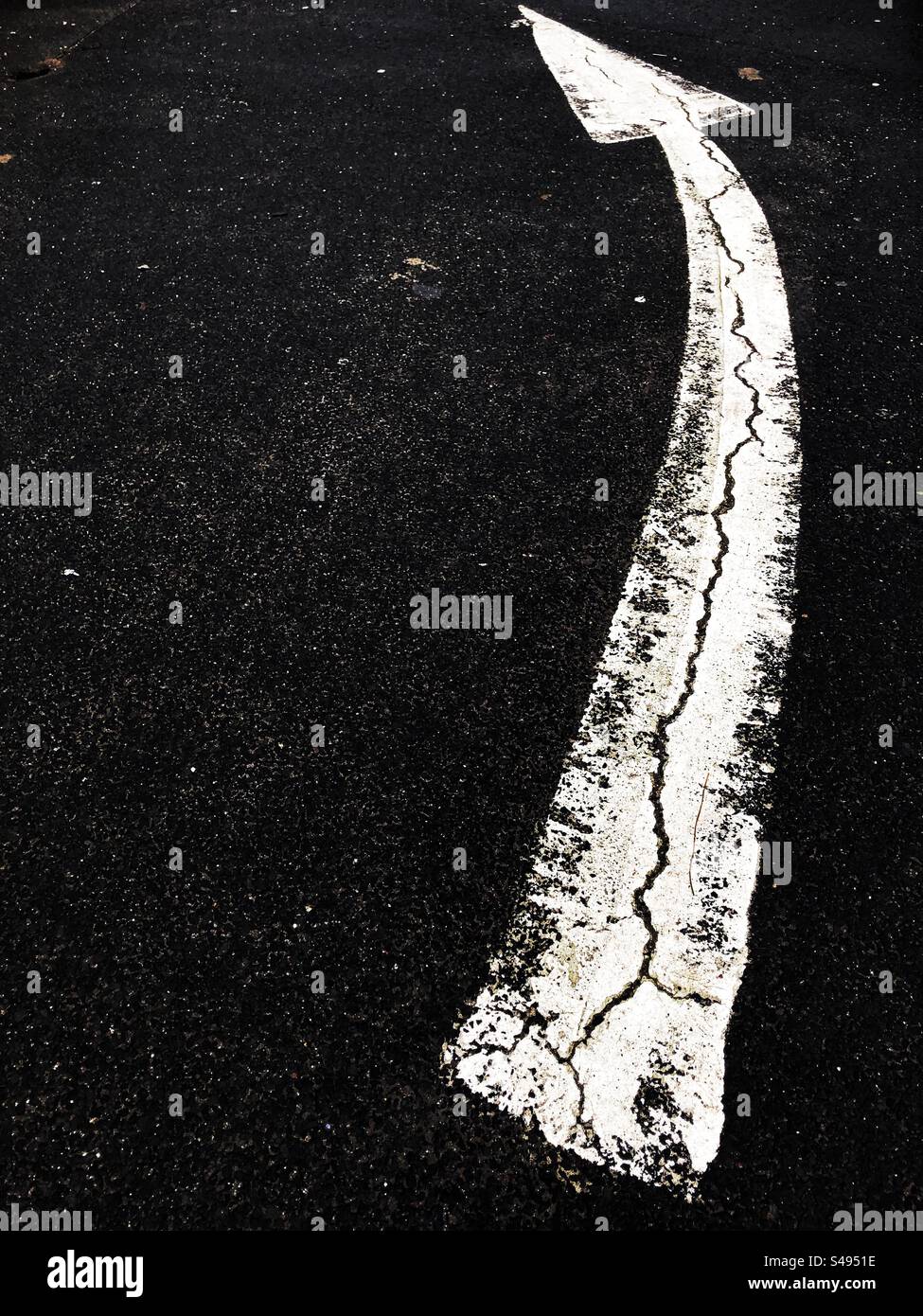 Turning left ahead arrow road markings - Smartphone Captured Stock Image