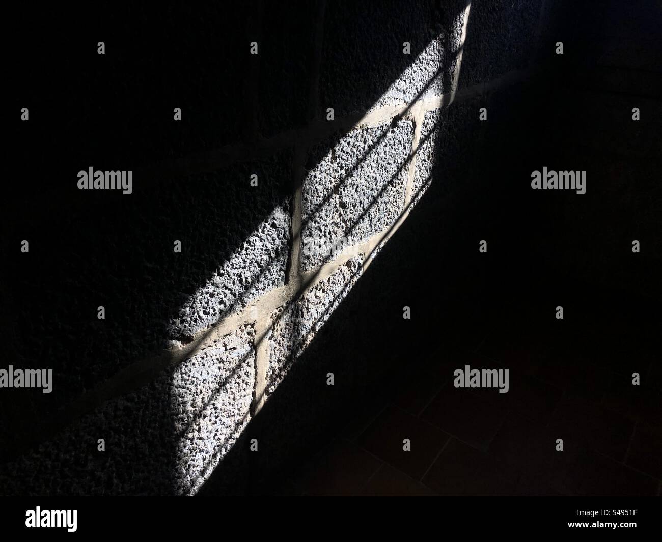 Light and shadow reflecting on an ancient wall - Smartphone Captured Stock Image