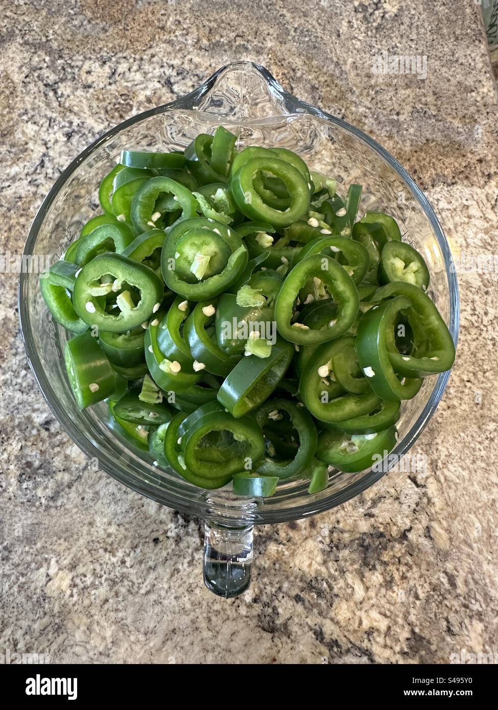 Top down view of sliced jalapeño peppers - Smartphone Captured Stock Image