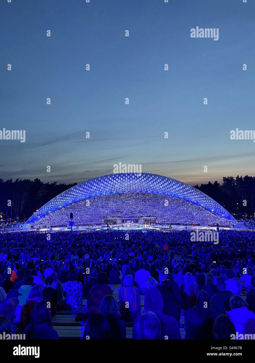 People watching Latvian song and dance festival choir concert at the