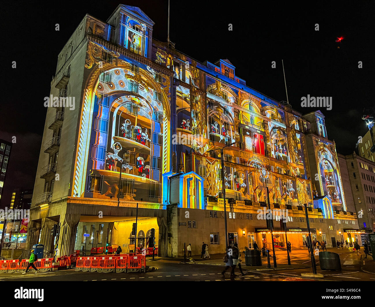 Queens hotel in Leeds city centre illuminated with a spectacular Christmas light show projection at night Stock Photo
