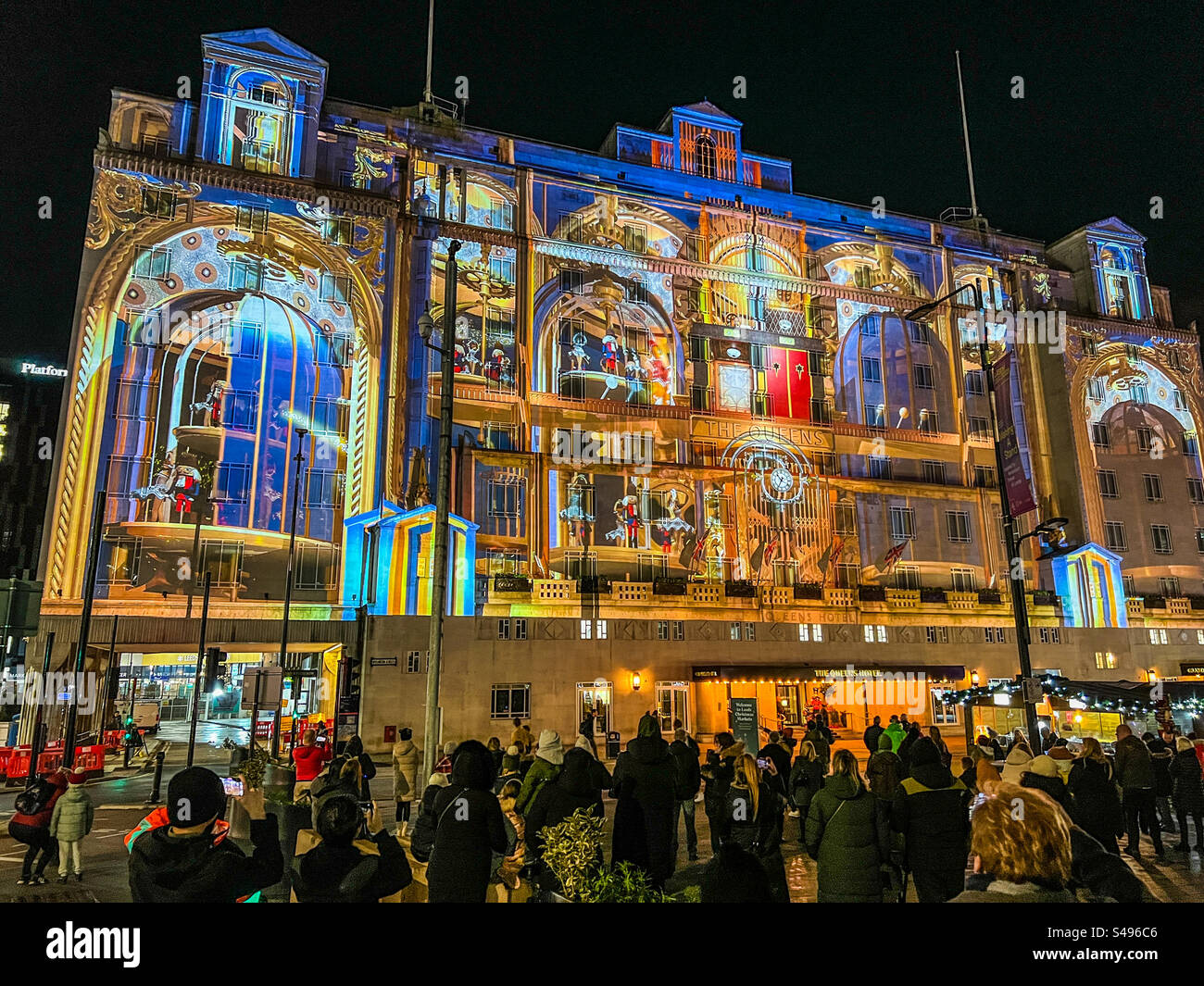 Queens hotel in Leeds city centre illuminated with a spectacular Christmas light show projection at night Stock Photo
